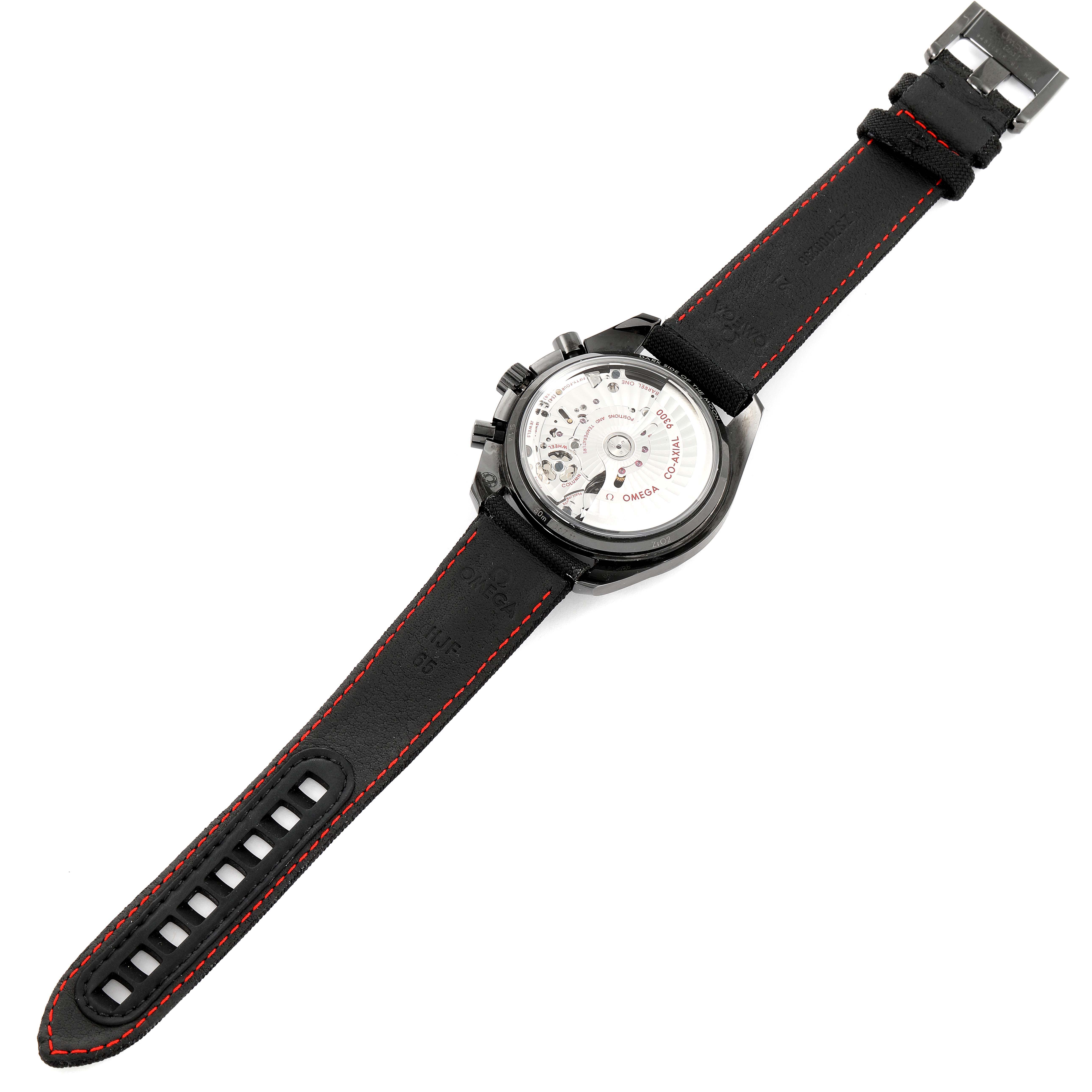 The image shows the back view of an Omega Speedmaster 311.92.44.51.01.003 Men's Ceramic Black Dial 311.92.44.51.01.003 Men's Ceramic Black Dial watch, highlighting its transparent case back and black strap with red stitching.