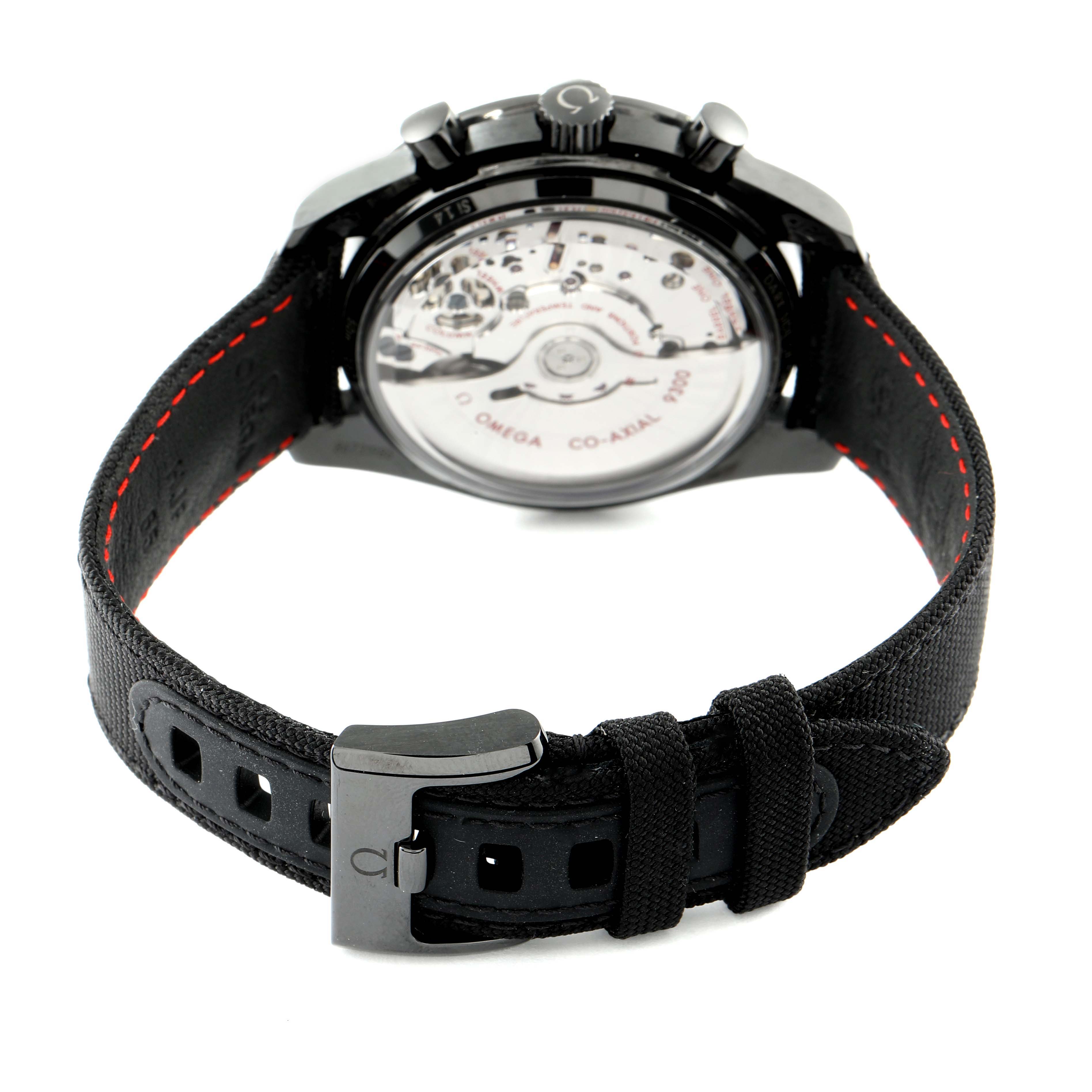 The image shows the back of an Omega Speedmaster 311.92.44.51.01.003 Men's Ceramic Black Dial 311.92.44.51.01.003 Men's Ceramic Black Dial watch, highlighting the movement and the inside of the strap with its clasp.