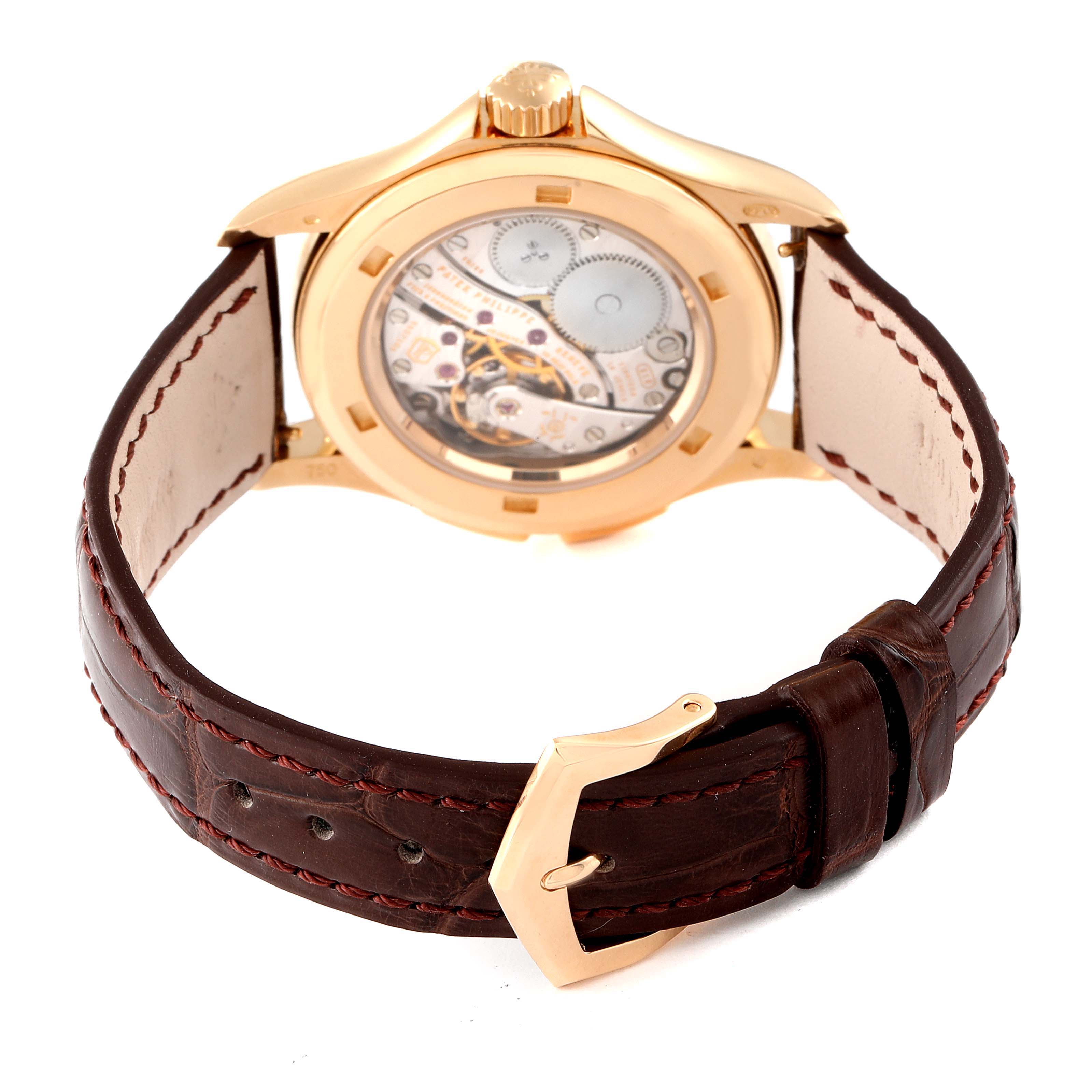 The image shows the back of the Patek Philippe Calatrava 4934R Men's Rose Gold Mother of Pearl Dial 4934R Men's Rose Gold Mother of Pearl Dial watch, displaying its case back and brown leather strap with stitching.
