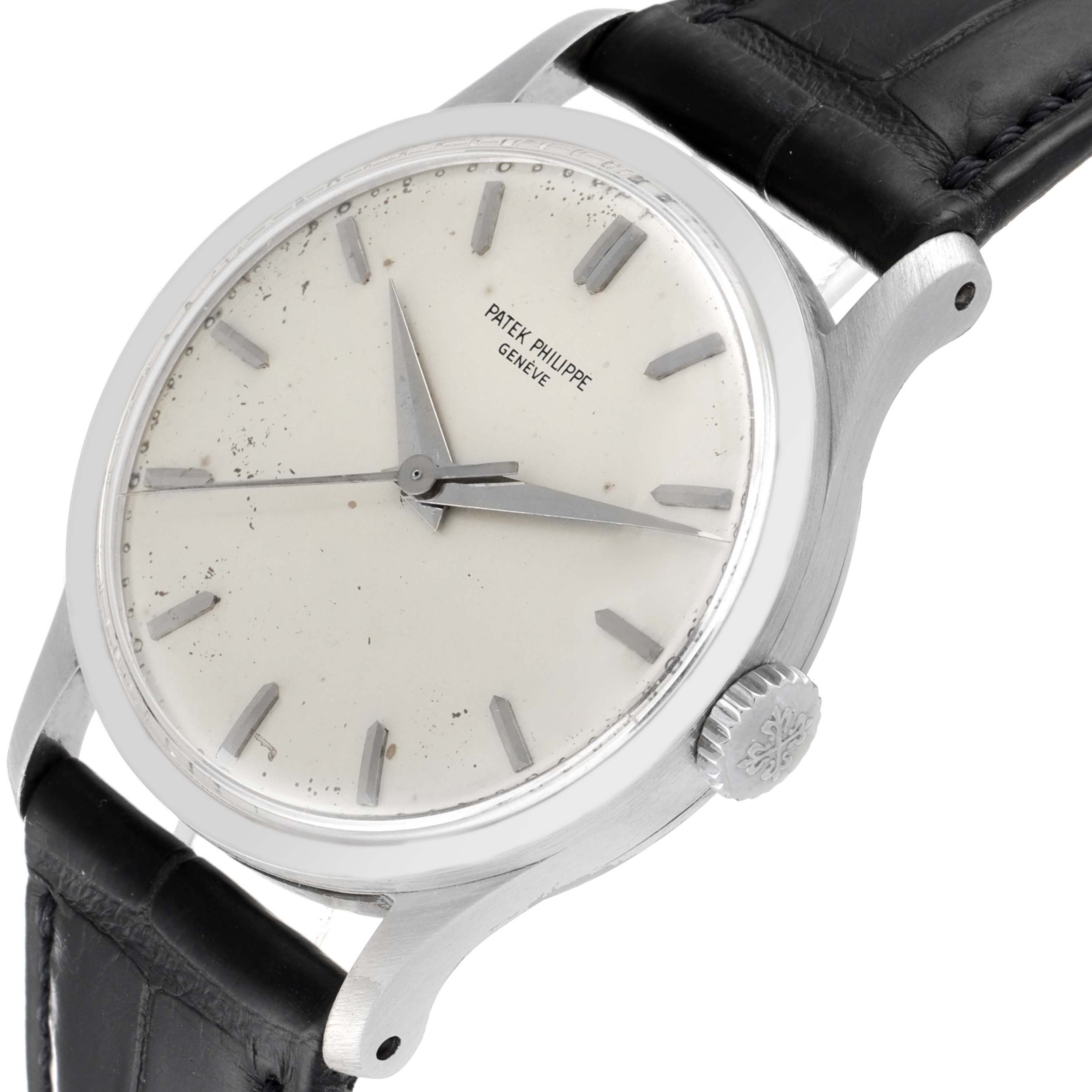 This Patek Philippe Calatrava 570 Men's White Gold Silver Dial 570 Men's White Gold Silver Dial watch is shown at an angle highlighting the dial, case, crown, and part of the strap.