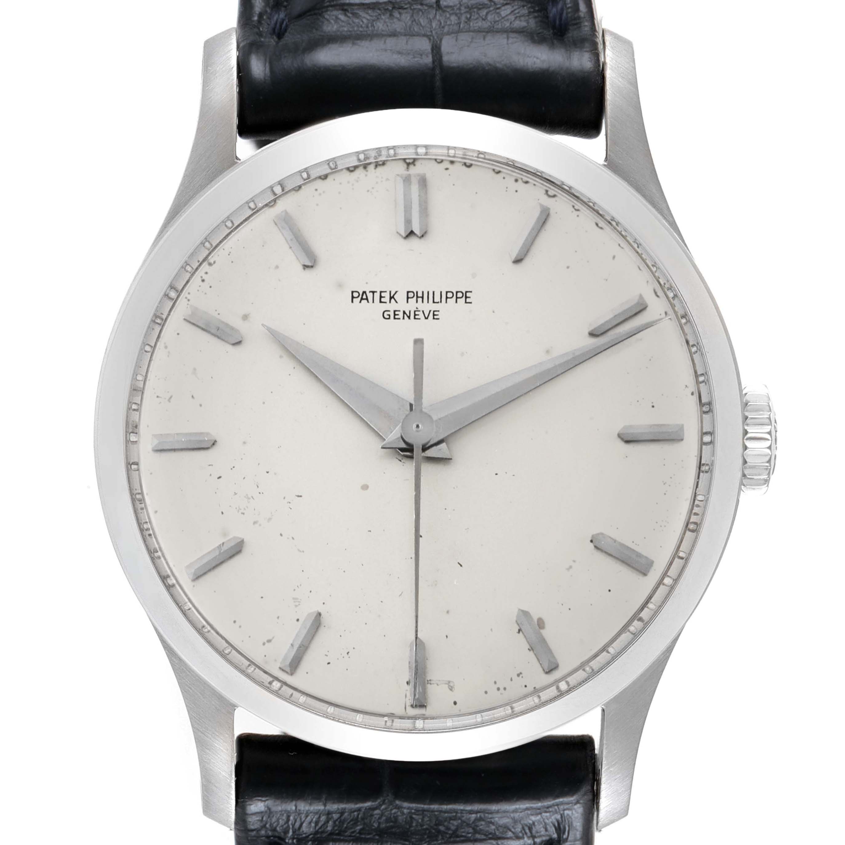 The image shows a front view of the Patek Philippe Calatrava 570 Men's White Gold Silver Dial watch, highlighting the dial, hands, markers, case, and a portion of the strap.