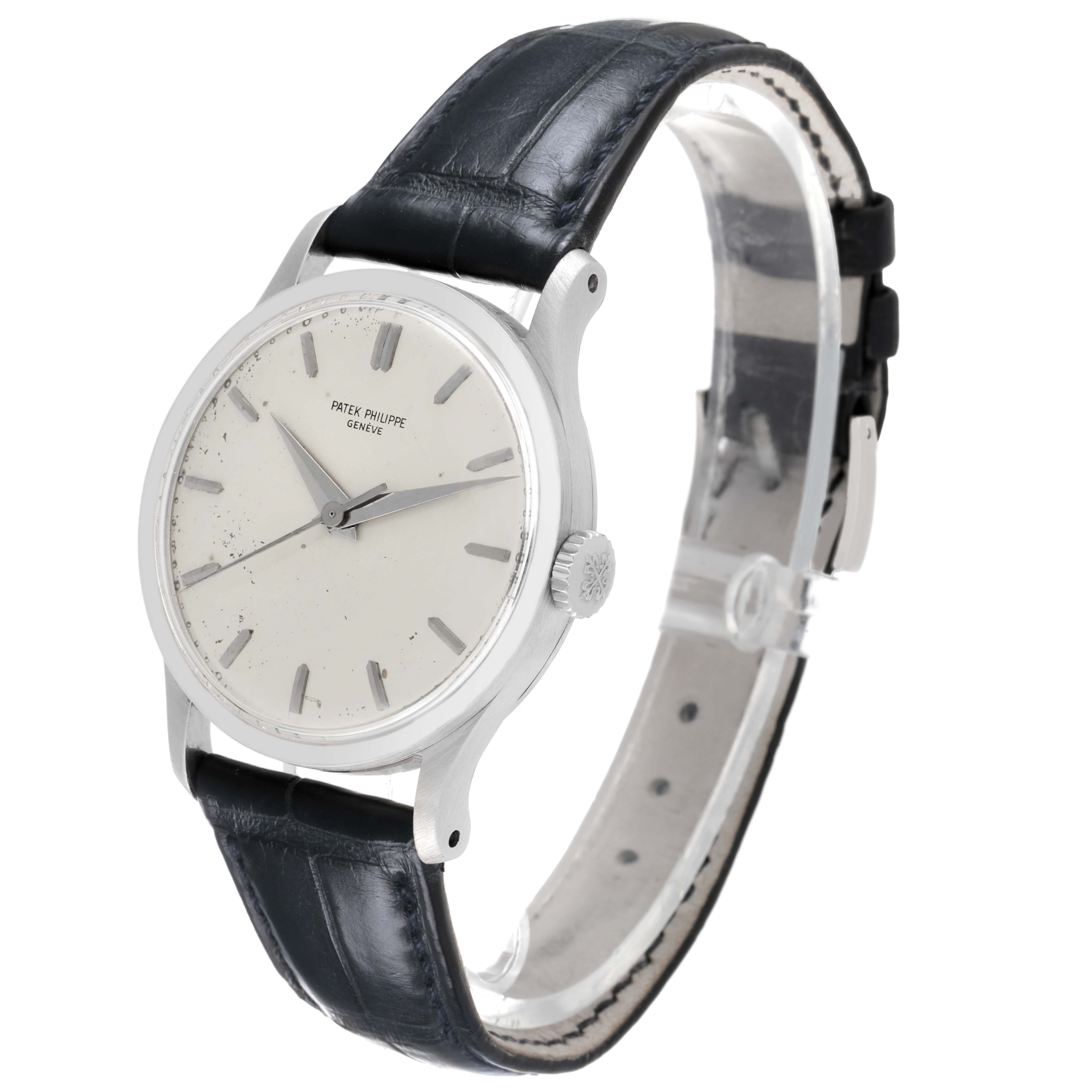 The image shows a Patek Philippe Calatrava 570 Men's White Gold Silver Dial watch at a slight angle, highlighting the dial, hands, and leather strap.