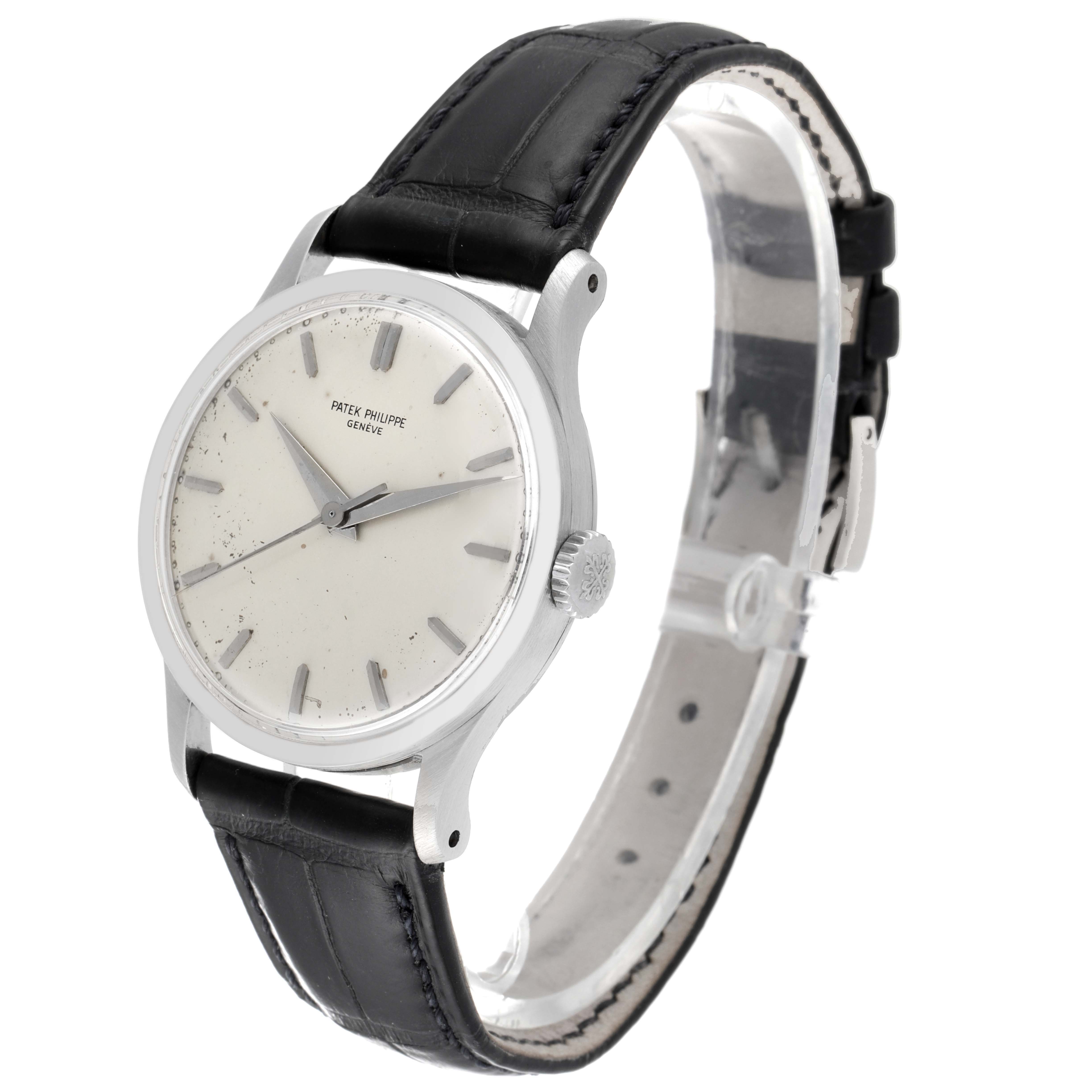 The image shows a Patek Philippe Calatrava 570 Men's White Gold Silver Dial 570 Men's White Gold Silver Dial watch at a three-quarter angle, highlighting the dial, crown, and leather strap.
