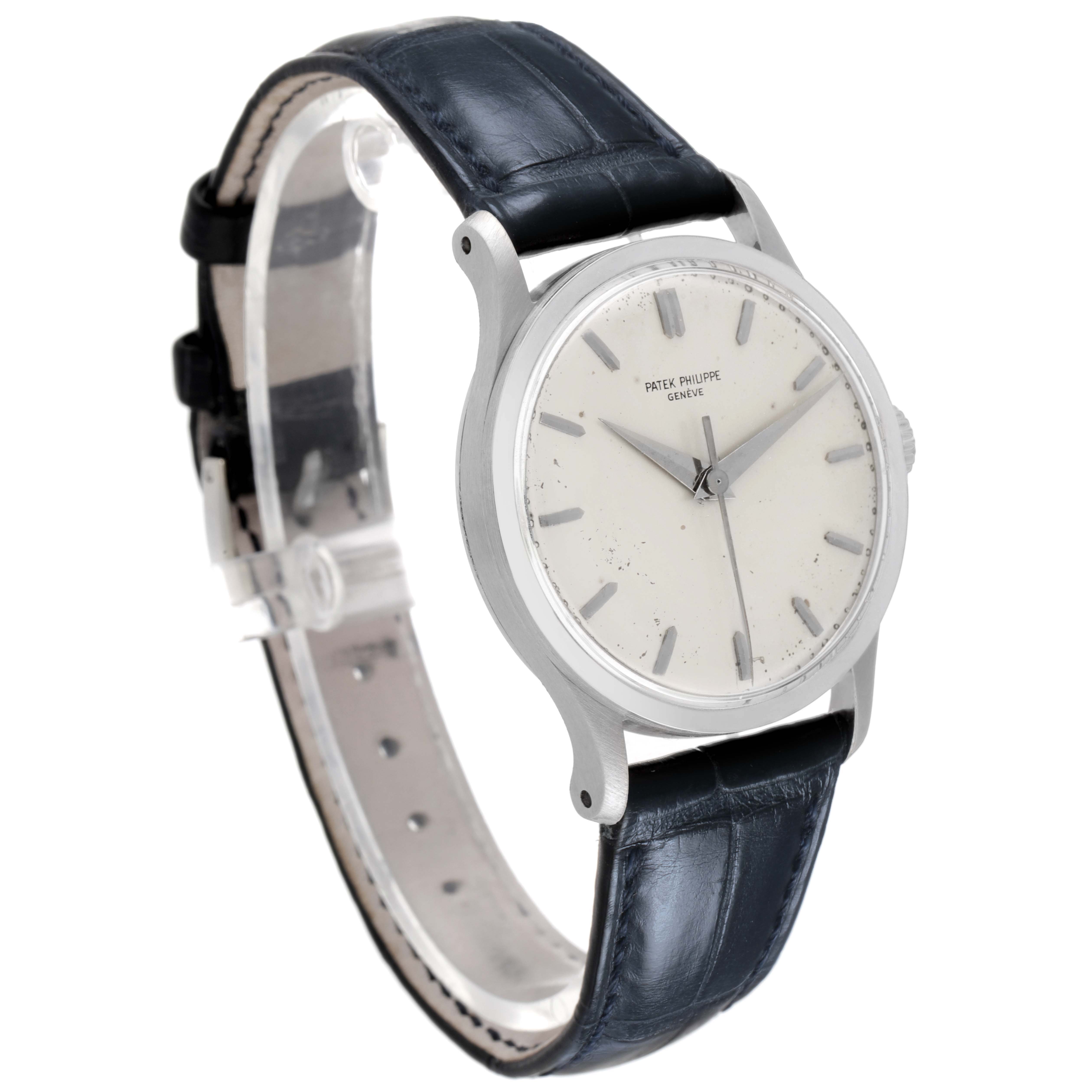 The Patek Philippe Calatrava 570 Men's White Gold Silver Dial watch is shown at a slight angle, highlighting the dial, case, and leather strap.