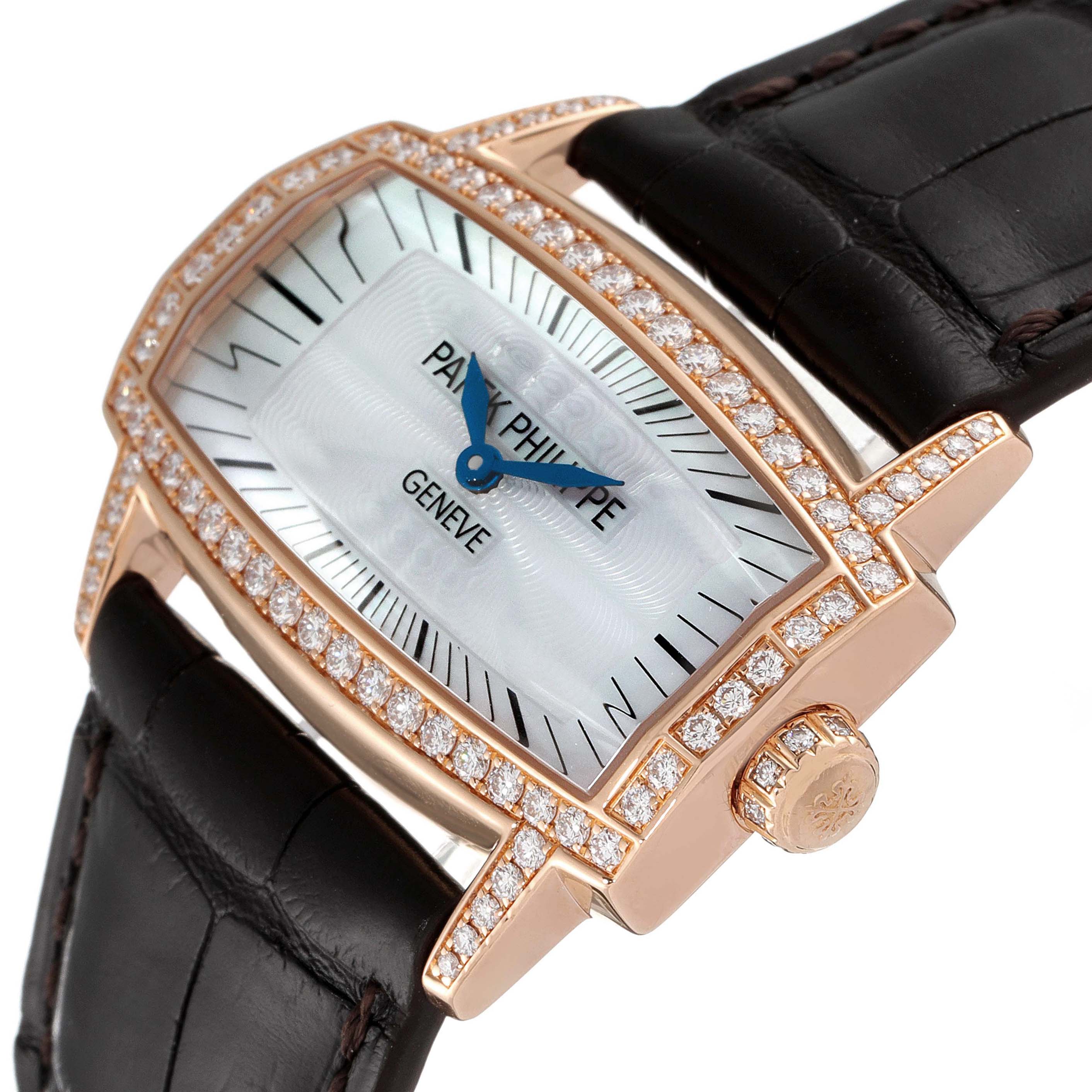 The image shows a close-up, angled view of a Patek Philippe Gondolo 4981R Women
s Rose Gold Mother of Pearl Dial 4981R Women
s Rose Gold Mother of Pearl Dial watch, highlighting its dial, diamond-encrusted bezel, crown, and leather strap.