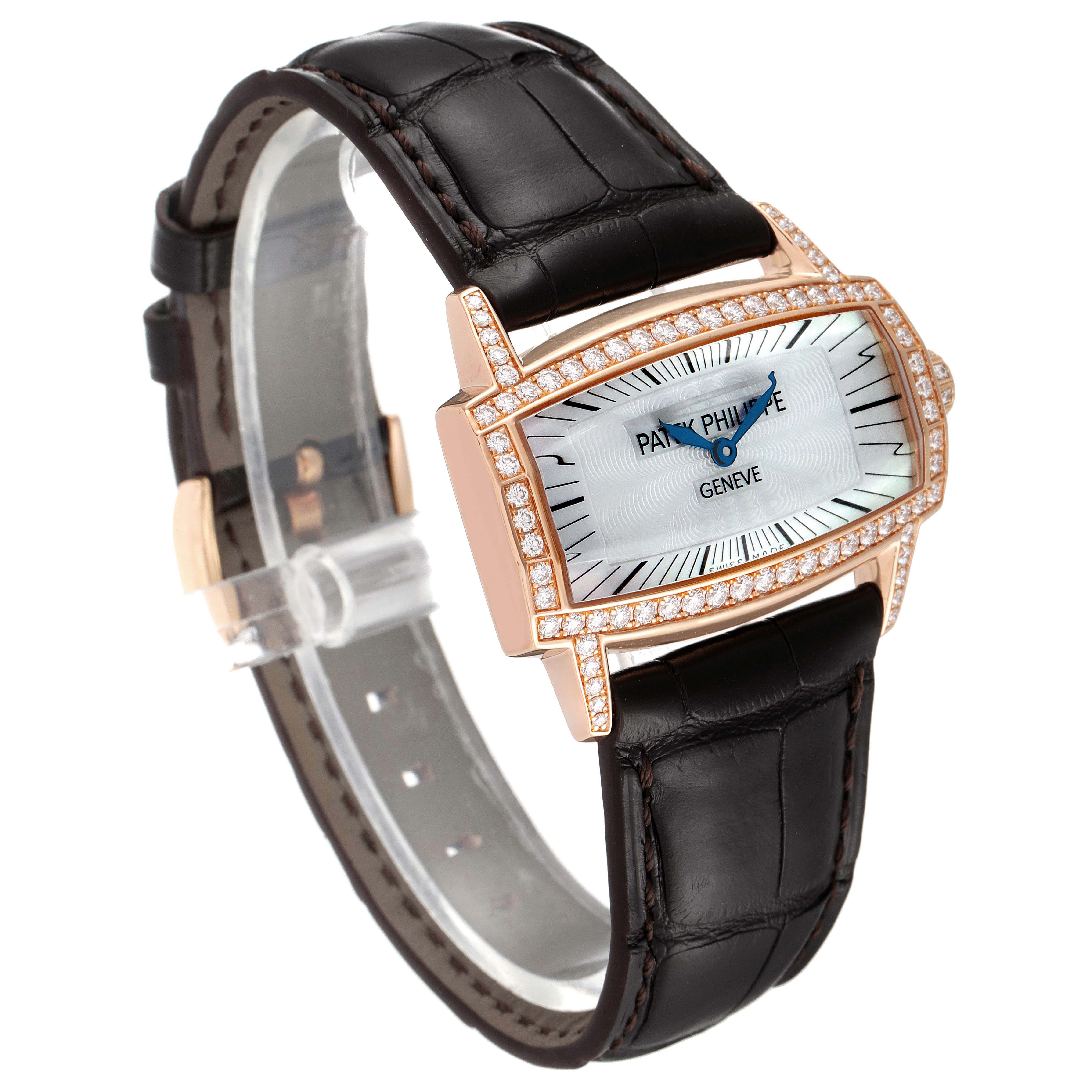 The Patek Philippe Gondolo 4981R Women
s Rose Gold Mother of Pearl Dial 4981R Women
s Rose Gold Mother of Pearl Dial watch is shown at a slight angle, highlighting its gold case, diamond bezel, white dial, and black leather strap.