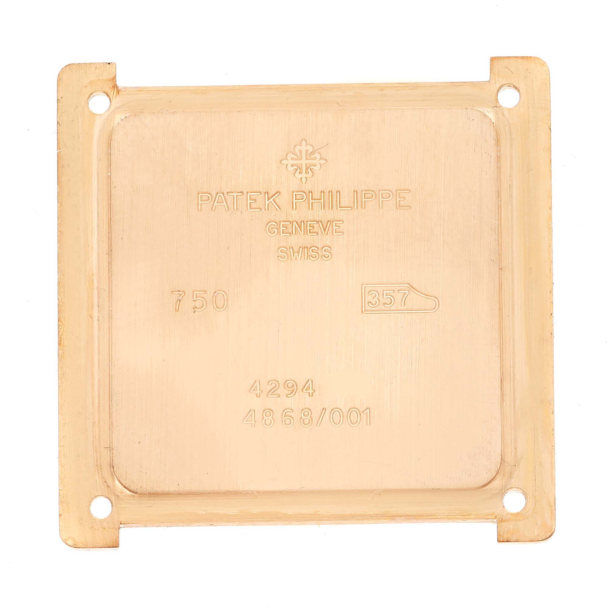 This image shows the backplate of a Patek Philippe Gondolo 4868/1R-010 Women's Rose Gold Brown Dial 4868/1R-010 Women's Rose Gold Brown Dial watch, highlighting engravings and hallmarks.