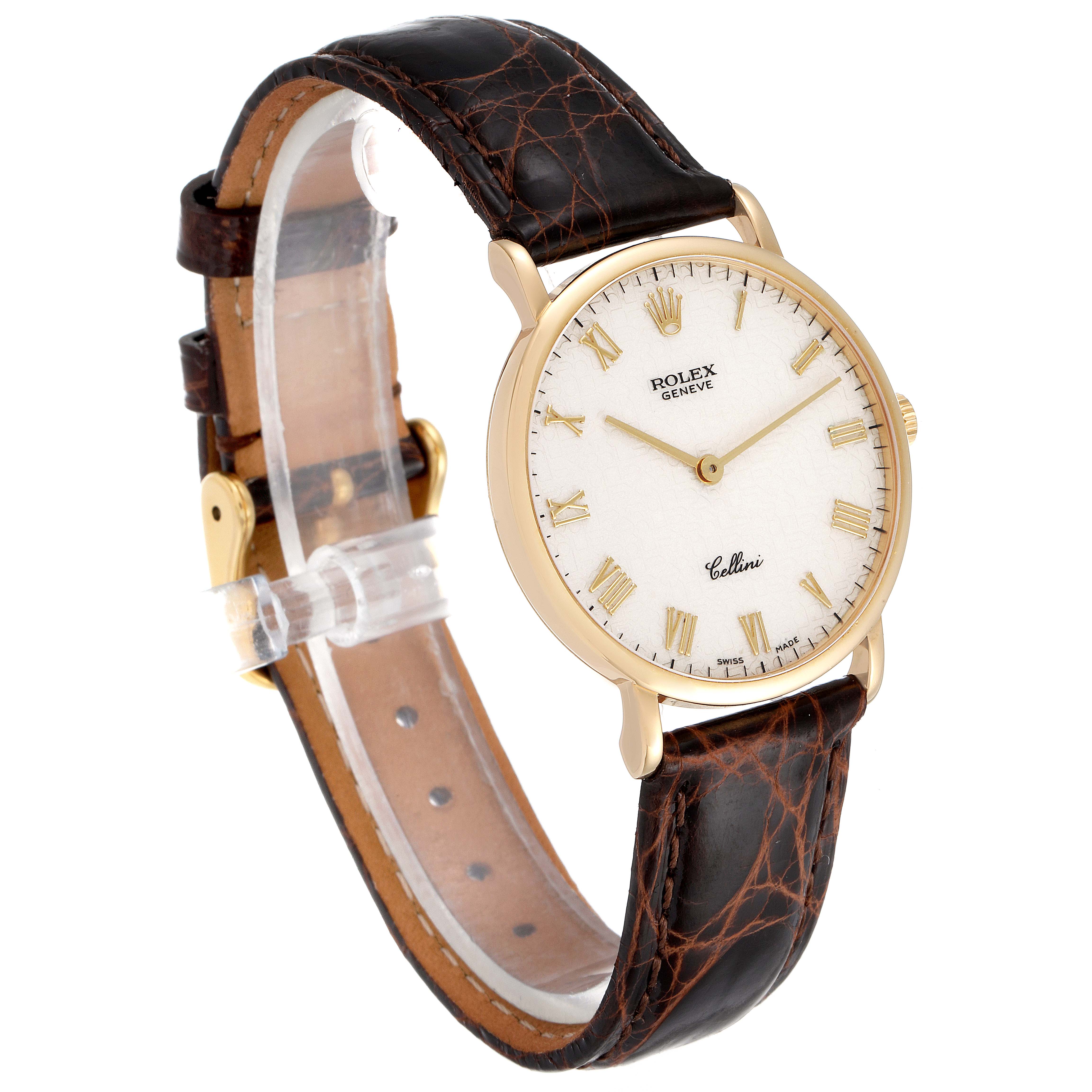 The Rolex Cellini 5112 Men's Yellow Gold Beige Dial 5112 Men's Yellow Gold Beige Dial watch is shown at an oblique angle, displaying its face, leather strap, and gold casing.