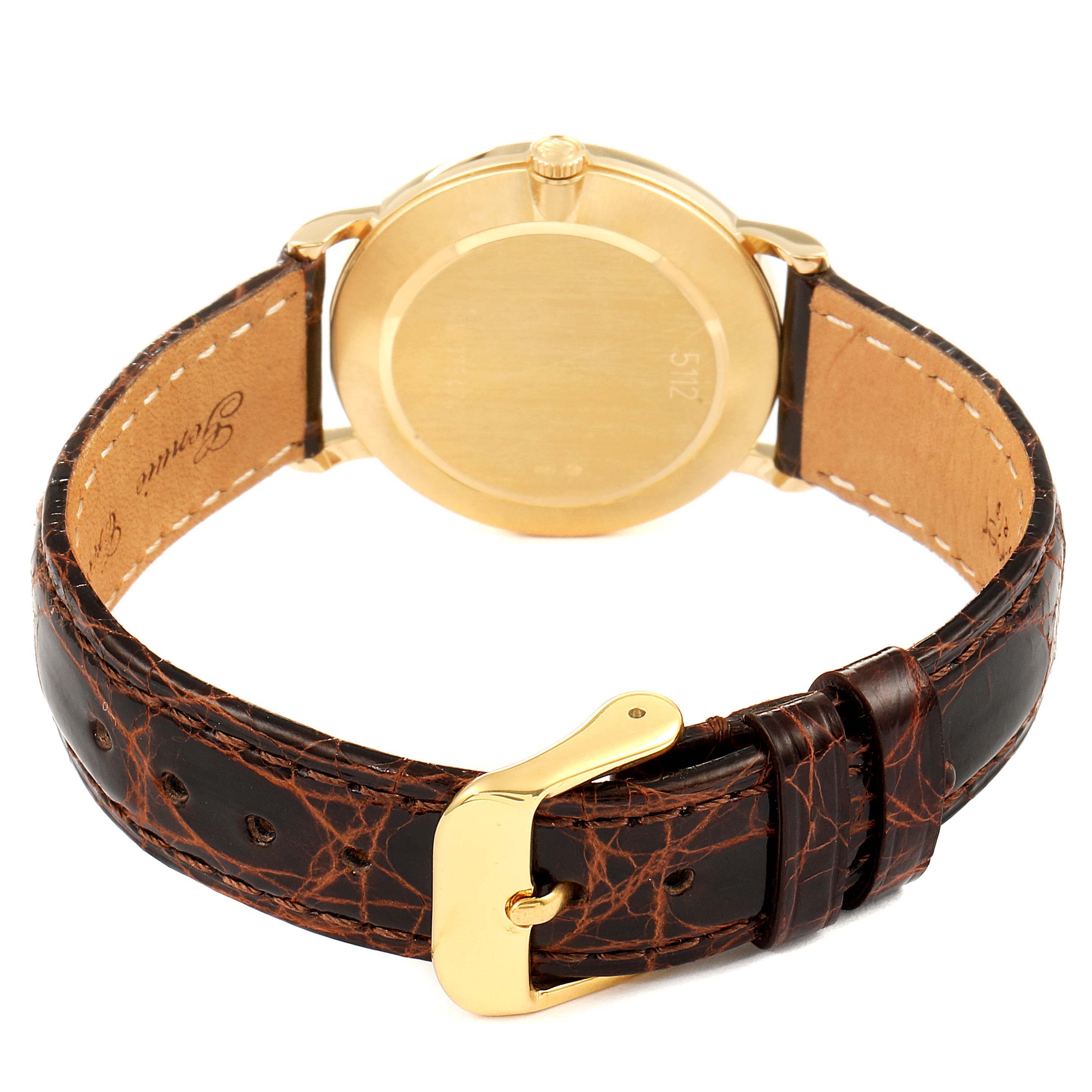 The image shows a rear view of the Rolex Cellini 5112 Men's Yellow Gold Beige Dial 5112 Men's Yellow Gold Beige Dial watch, highlighting the back cover and leather strap with a gold buckle.