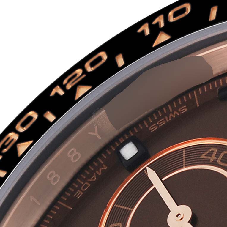 The image shows a close-up view of the bezel and dial of a Rolex Daytona 116515 Men's Rose Gold Brown Dial 116515 Men's Rose Gold Brown Dial watch.