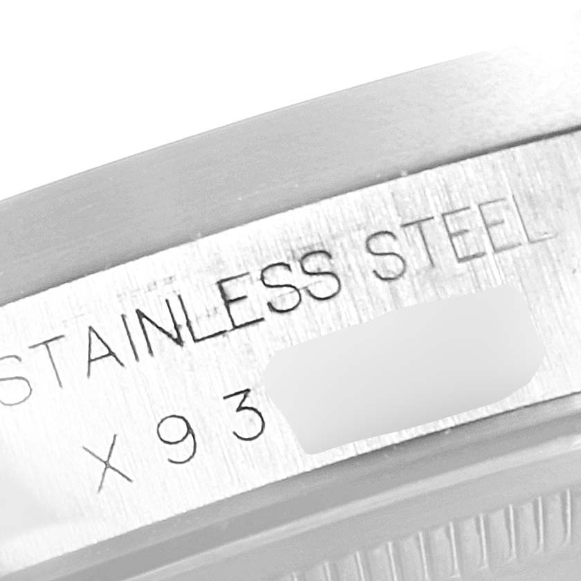 The image shows a close-up view of the side of a stainless steel case for a Rolex Air-King 15210 Men's Stainless Steel Silver Dial 15210 Men's Stainless Steel Silver Dial watch.