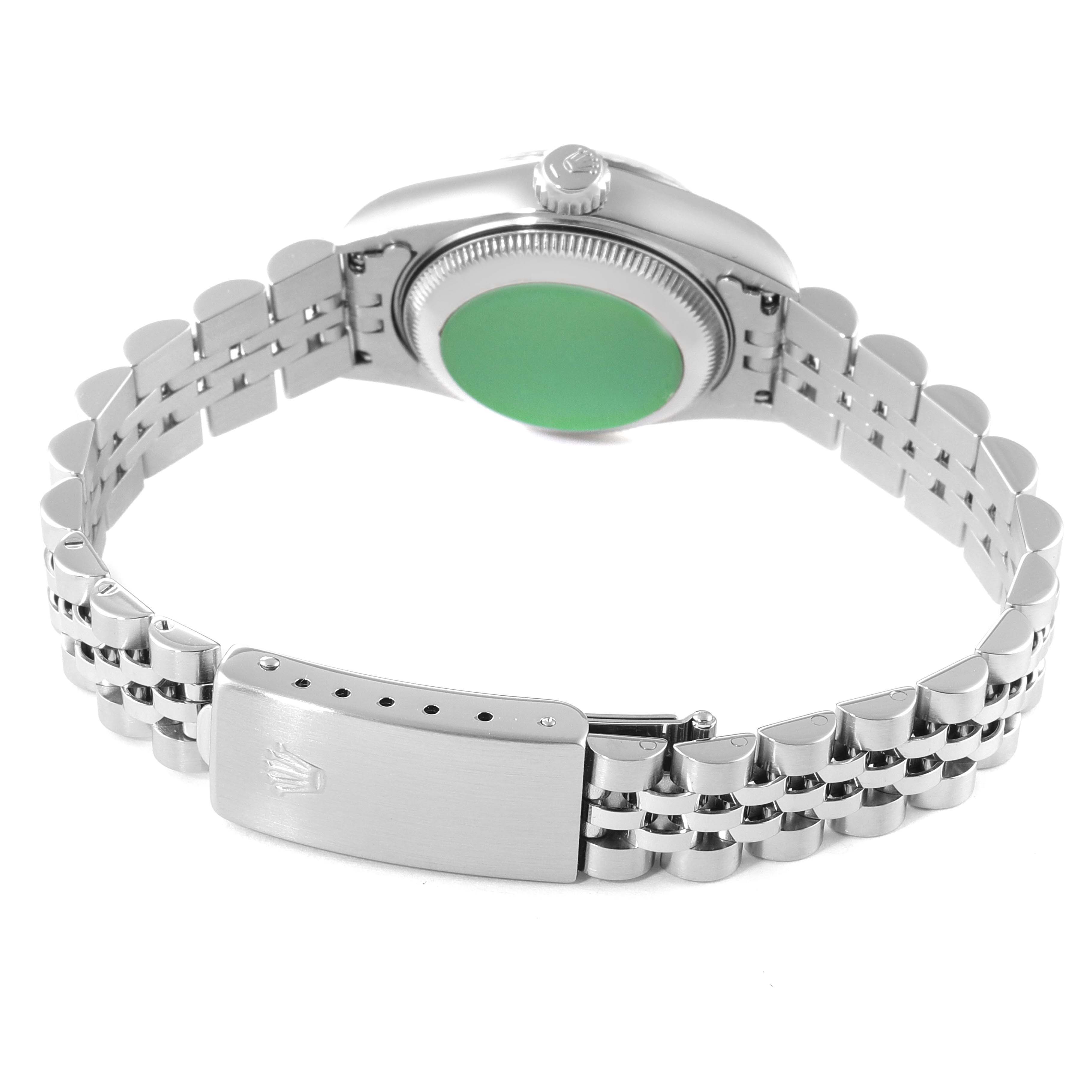 The image shows a Rolex Datejust 69174 Women
s Stainless Steel White Dial 69174 Women
s Stainless Steel White Dial watch from the back, highlighting its bracelet, clasp, and case back.