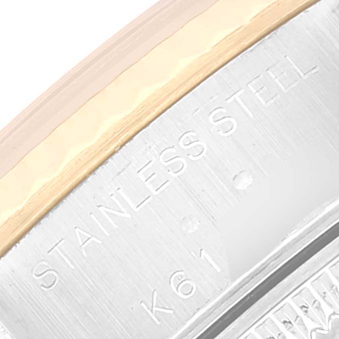 This image shows a close-up of the bezel and case of a Rolex Datejust 79173 Women's Steel and Gold (two tone) White Dial 79173 Women's Steel and Gold (two tone) White Dial watch, highlighting the "STAINLESS STEEL" engraving.