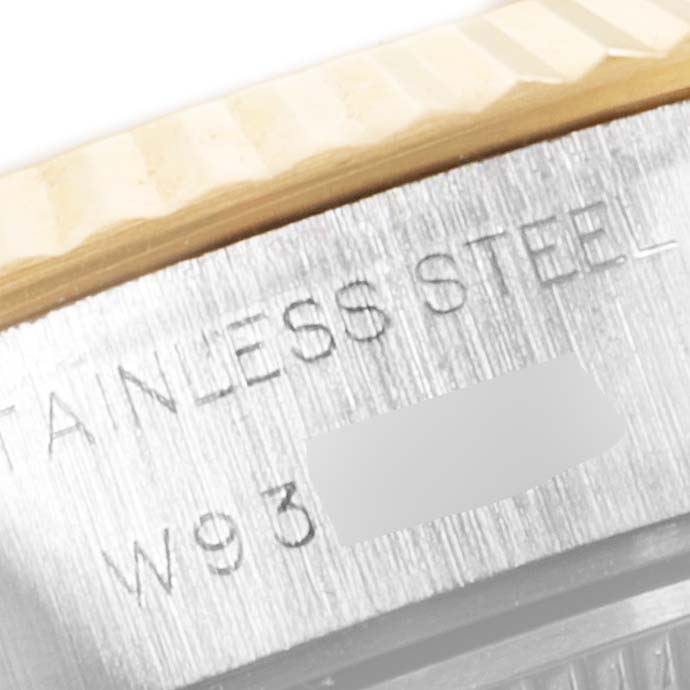 This close-up image shows the bezel and "STAINLESS STEEL" engraving on the casing of a Rolex Datejust 69173 Women
s Steel and Gold (two tone) Champagne Dial 69173 Women
s Steel and Gold (two tone) Champagne Dial watch.