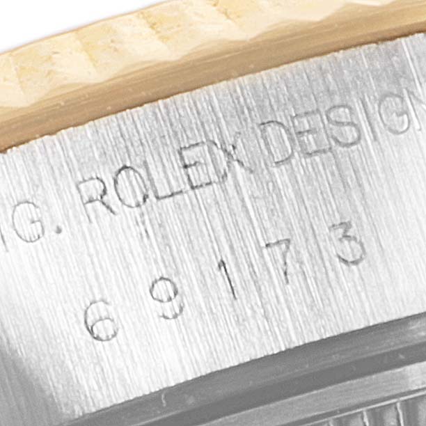 Close-up of the model number and bezel of the Rolex Datejust 69173 Women
s Steel and Gold (two tone) Champagne Dial 69173 Women
s Steel and Gold (two tone) Champagne Dial watch.