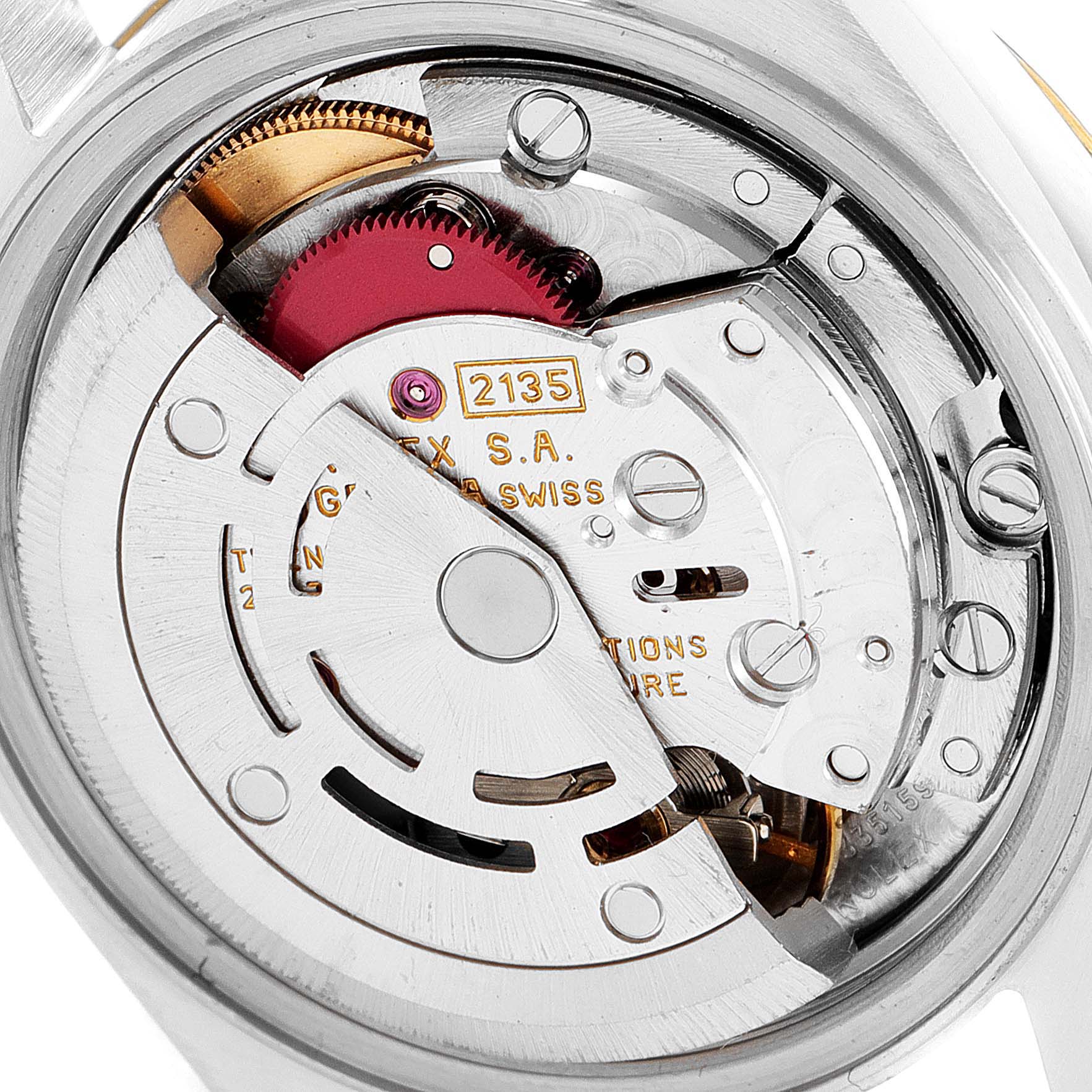 This image shows the internal mechanism of the Rolex Datejust 69173 Women
s Steel and Gold (two tone) Champagne Dial 69173 Women
s Steel and Gold (two tone) Champagne Dial watch, featuring the movement and rotor at a close-up angle.