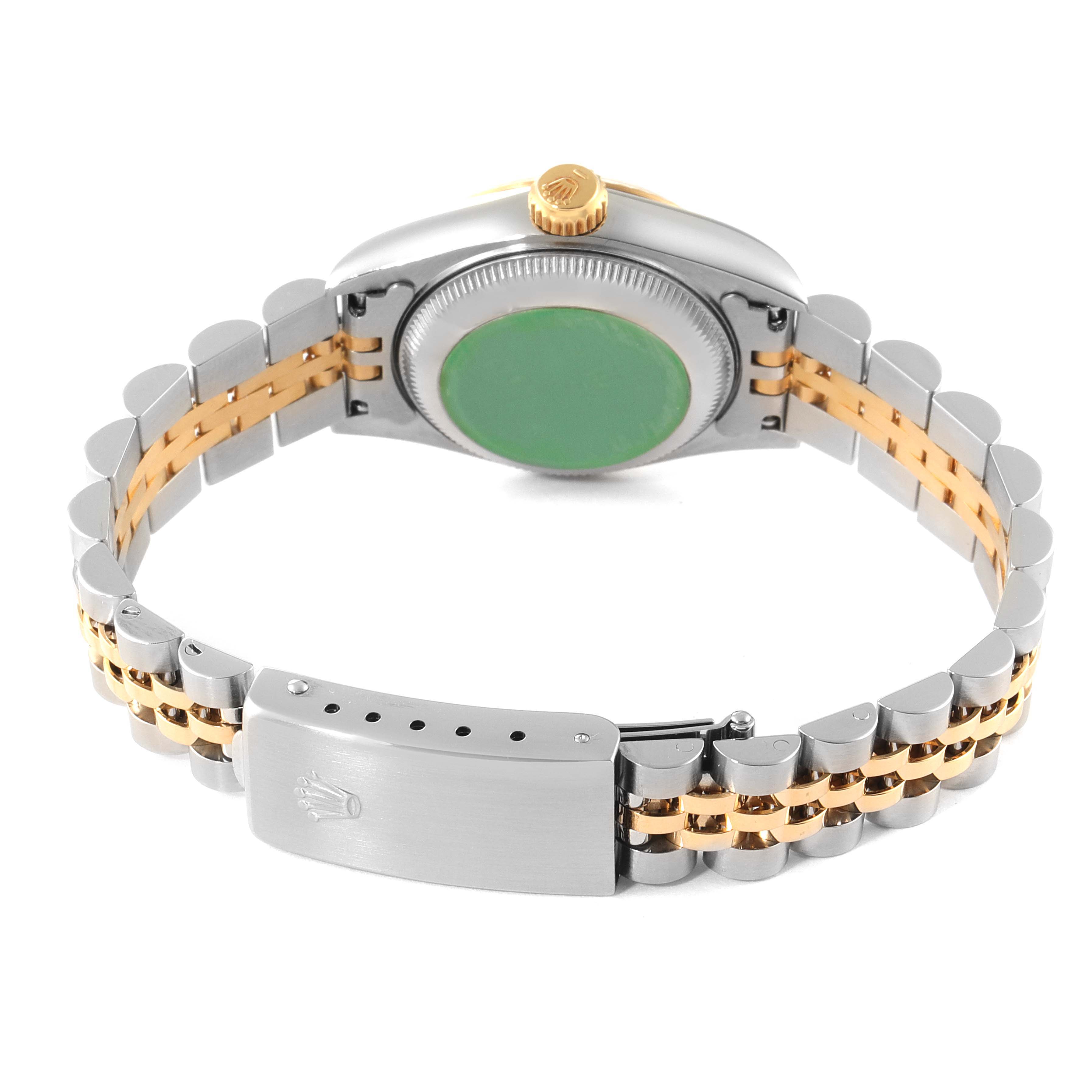 The image displays the back view of a Rolex Datejust 69173 Women
s Steel and Gold (two tone) Champagne Dial 69173 Women
s Steel and Gold (two tone) Champagne Dial model watch, focusing on its clasp, case back, and two-tone bracelet.