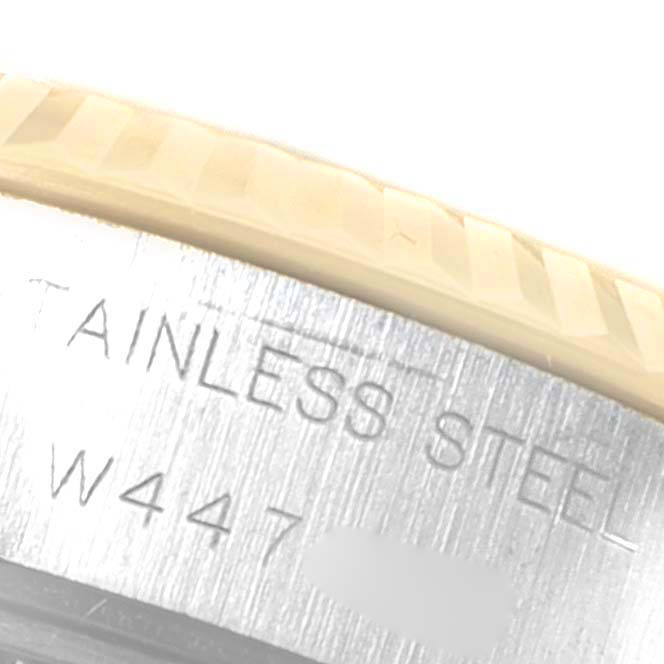 This close-up image shows the edge of the bezel and part of the case back engraving of a Rolex Datejust 69173 Women
s Steel and Gold (two tone) Champagne Dial 69173 Women
s Steel and Gold (two tone) Champagne Dial watch.