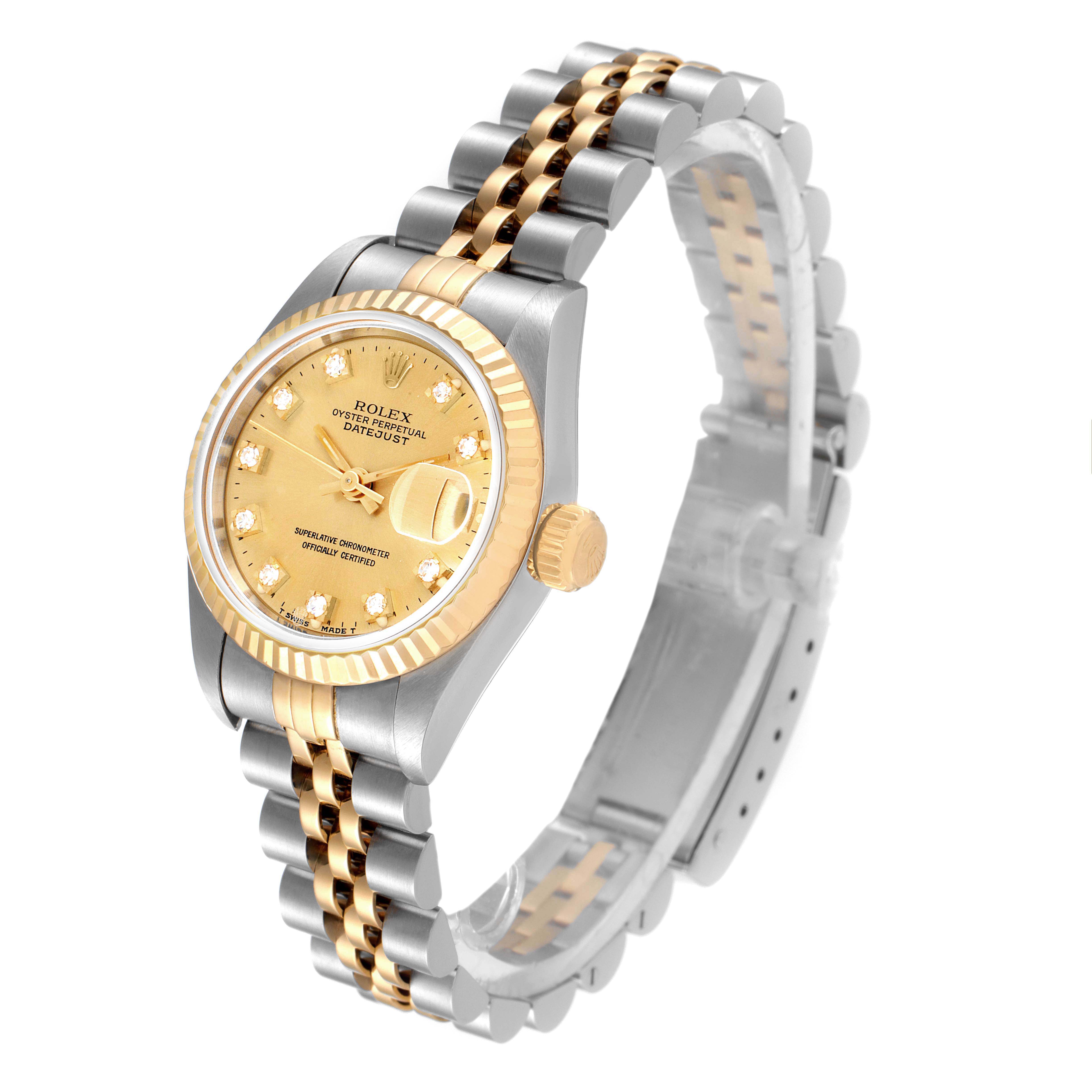 This image shows a side angle of the Rolex Datejust 69173 Women
s Steel and Gold (two tone) Champagne Dial 69173 Women
s Steel and Gold (two tone) Champagne Dial watch, highlighting the gold dial, fluted bezel, and two-tone bracelet.