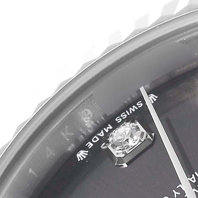This close-up of the Rolex Datejust 279174 Women's Stainless Steel Grey Dial 279174 Women's Stainless Steel Grey Dial watch showcases a diamond hour marker, "SWISS MADE" text, and part of the bezel.