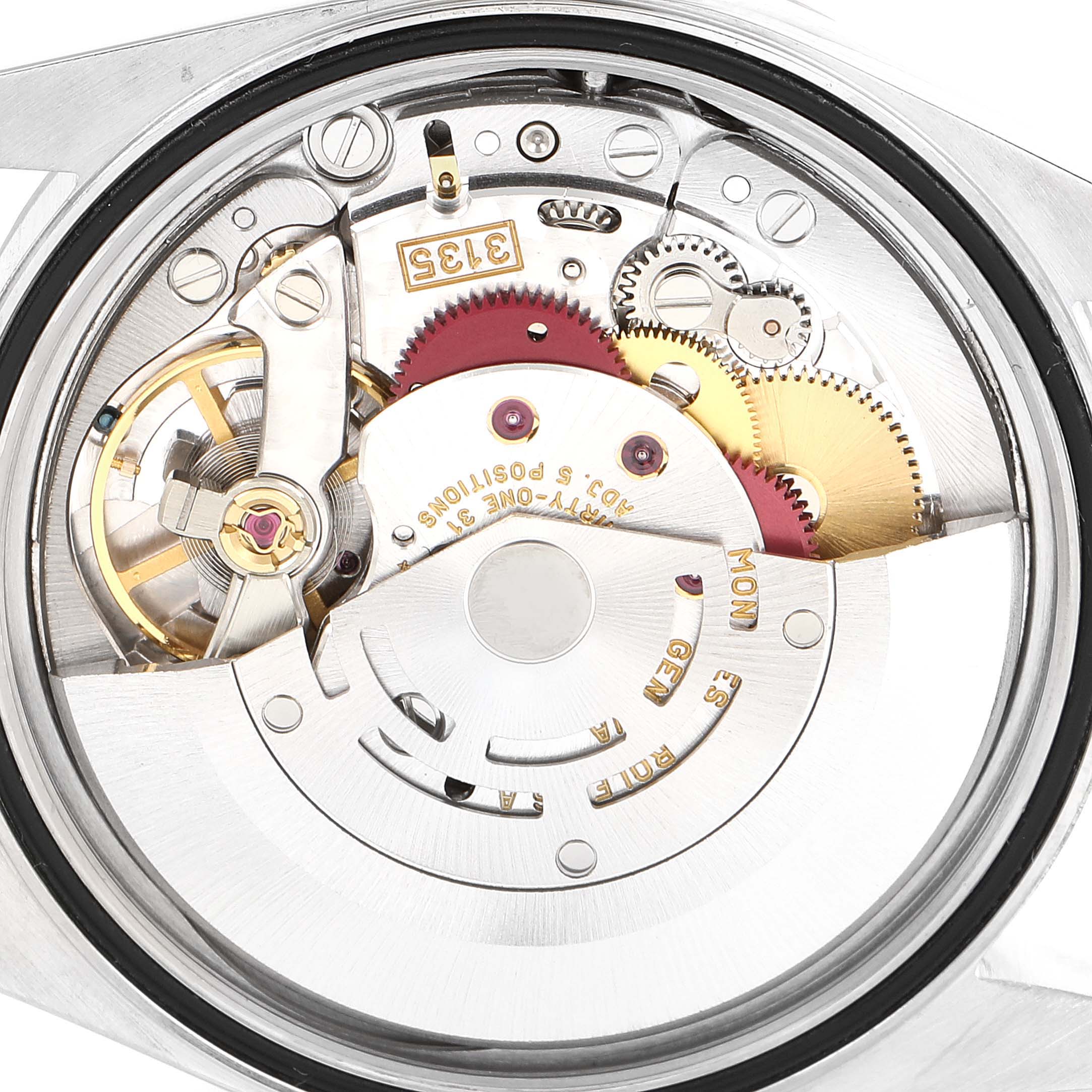 The image shows an inside view of the Rolex Datejust 16234 Men's Stainless Steel Blue Dial 16234 Men's Stainless Steel Blue Dial watch, focusing on its intricate mechanical movement parts.