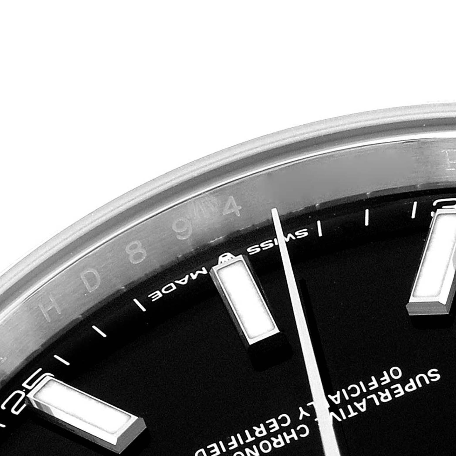 The image shows a close-up of the dial and hands of a Rolex Datejust 41 126300 Men's Stainless Steel Black Dial 126300 Men's Stainless Steel Black Dial watch, highlighting the indices and text.