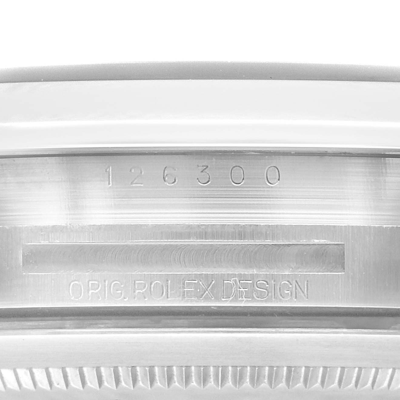 This image shows a close-up of the serial number and engraving on the side of the case of the Rolex Datejust 41 126300 Men's Stainless Steel Black Dial 126300 Men's Stainless Steel Black Dial model.