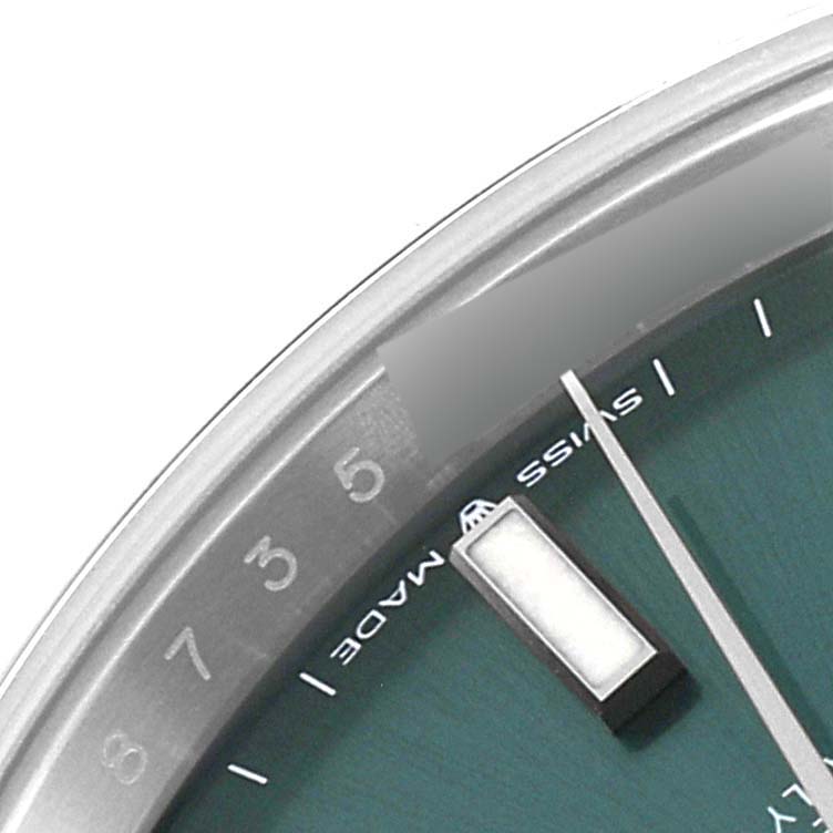 This image shows a close-up of the dial of the Rolex Datejust 41 126300 Men
s Stainless Steel Green Dial 126300 Men
s Stainless Steel Green Dial, displaying part of the minute track and hour markers.