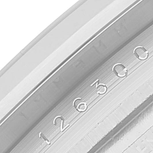 This image shows a close-up angle of the inner bezel and part of the case of a Rolex Datejust 41 126300 Men
s Stainless Steel Green Dial 126300 Men
s Stainless Steel Green Dial watch, highlighting engraved numbers.