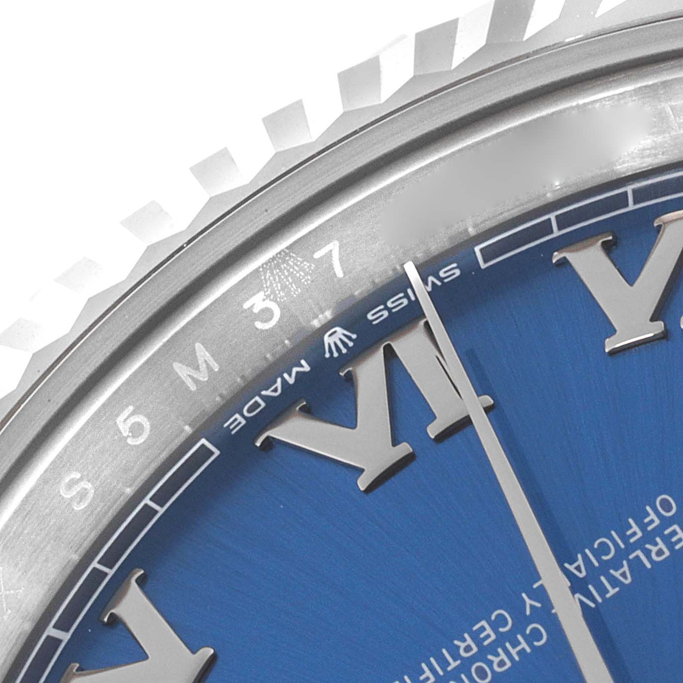 This close-up angle of the Rolex Datejust 41 126334 Men's Stainless Steel Blue Dial 126334 Men's Stainless Steel Blue Dial shows part of the dial, bezel, and the minute hand.