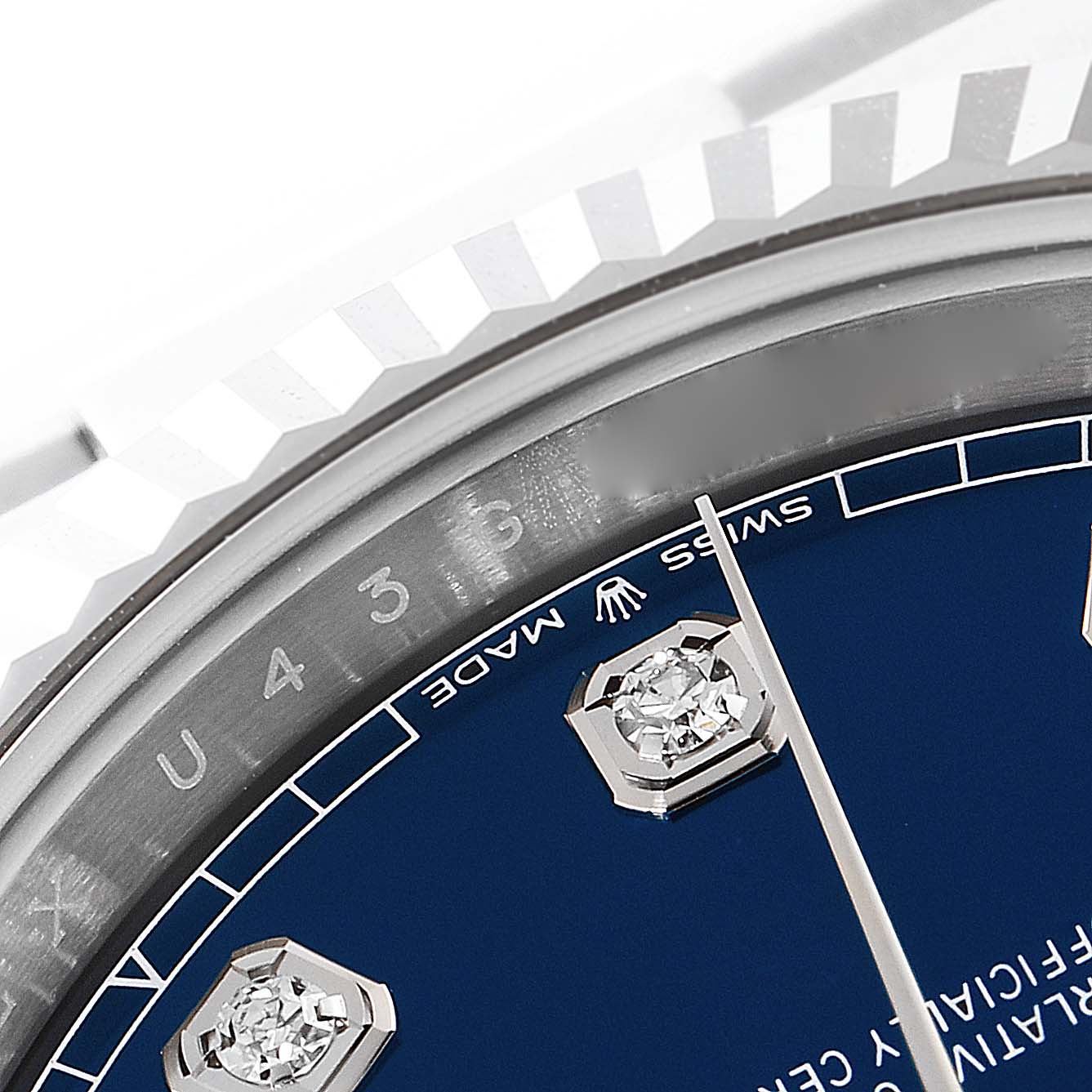 This image shows a close-up of the dial and bezel of a Rolex Datejust 41 126334 Men's Stainless Steel Blue Dial 126334 Men's Stainless Steel Blue Dial, highlighting its markers and part of the chapter ring.