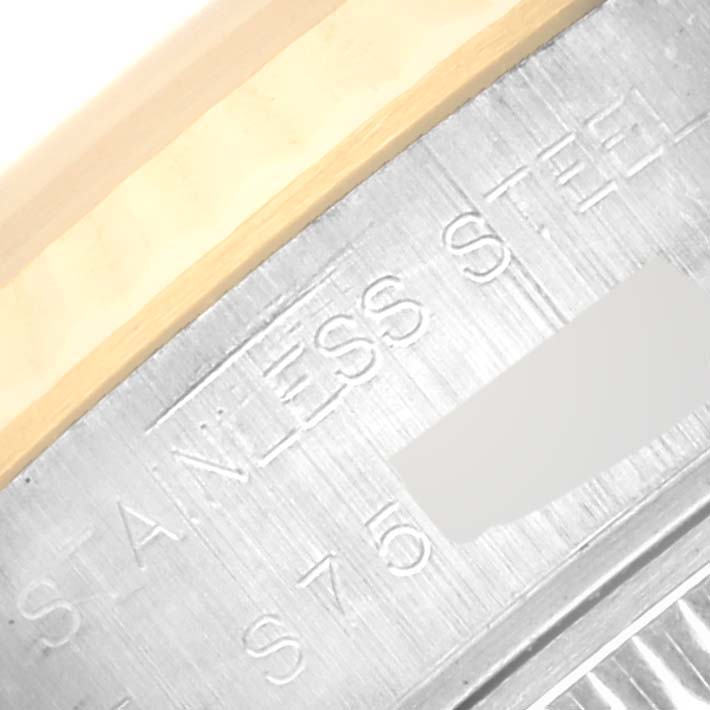 This image shows a close-up of the edge and engraving on the inner bezel of a Rolex Datejust 69173 Women's Steel and Gold (two tone) Champagne Dial 69173 Women's Steel and Gold (two tone) Champagne Dial watch.
