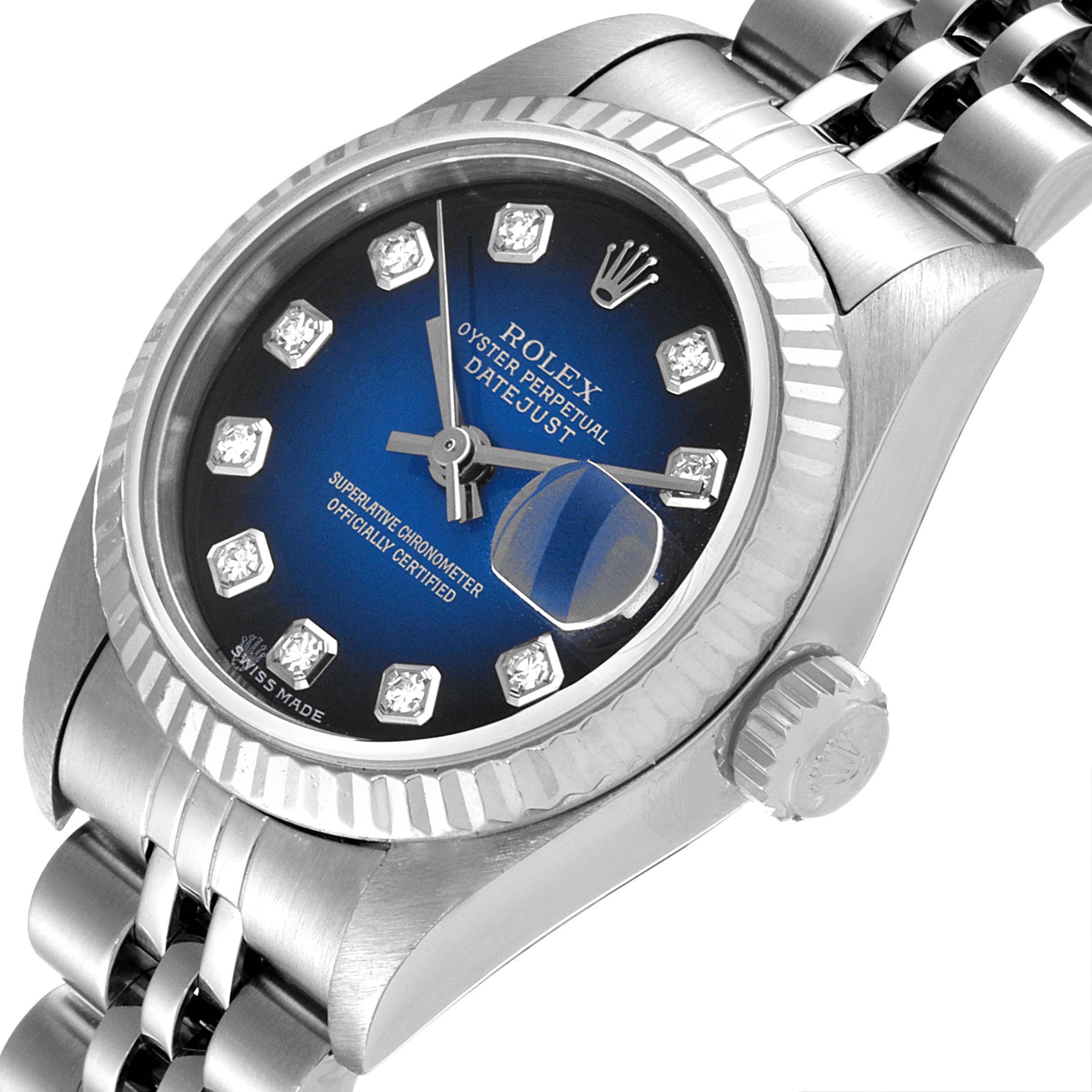 This Rolex Datejust 79174 Women's Stainless Steel Blue Dial 79174 Women's Stainless Steel Blue Dial watch is shown at a tilted angle, highlighting its face, bezel, crown, and part of the bracelet.