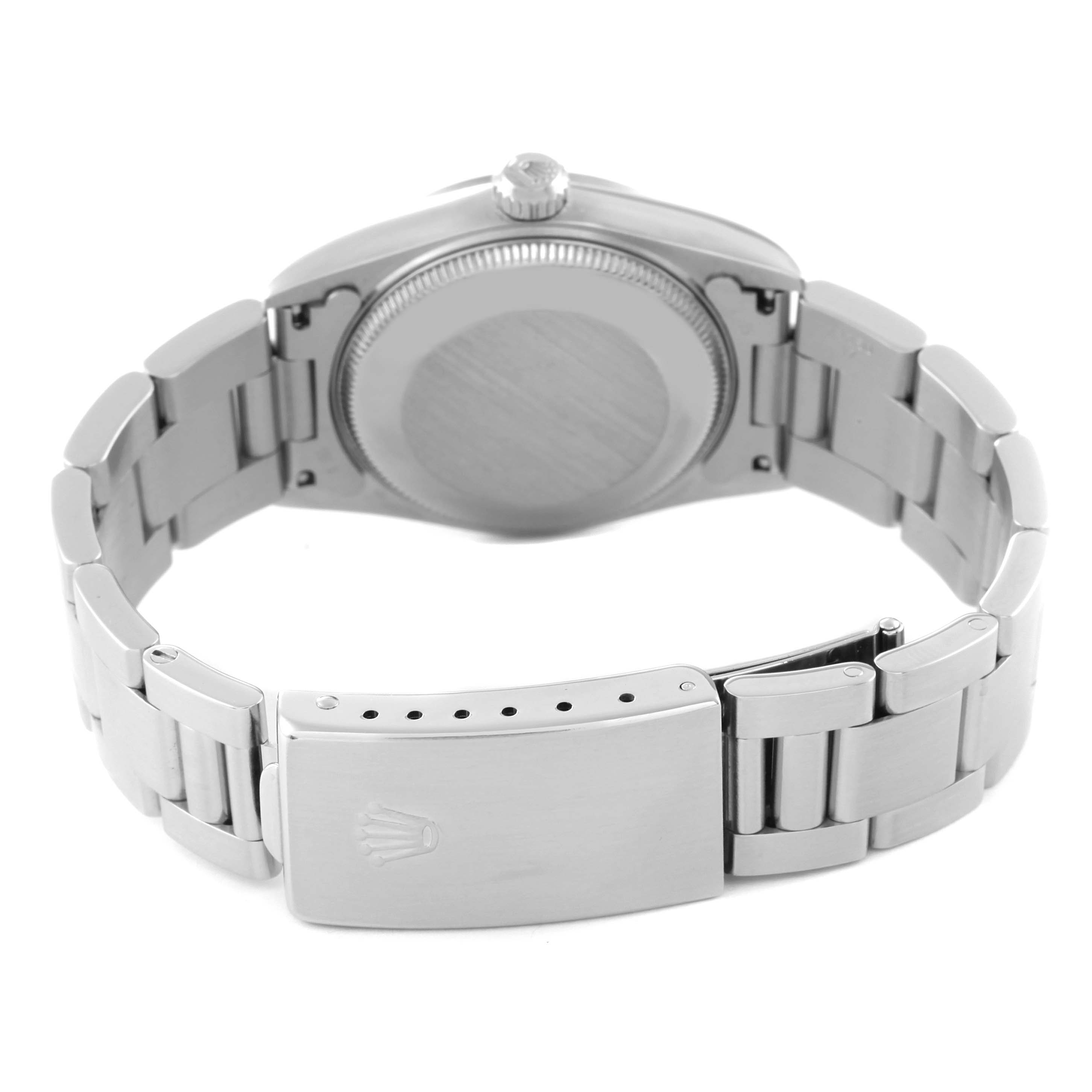 This image shows the back side of a Rolex Mid-Size 68240 Women
s Stainless Steel Silver Dial 68240 Women
s Stainless Steel Silver Dial watch, highlighting the case back, bracelet, and clasp.