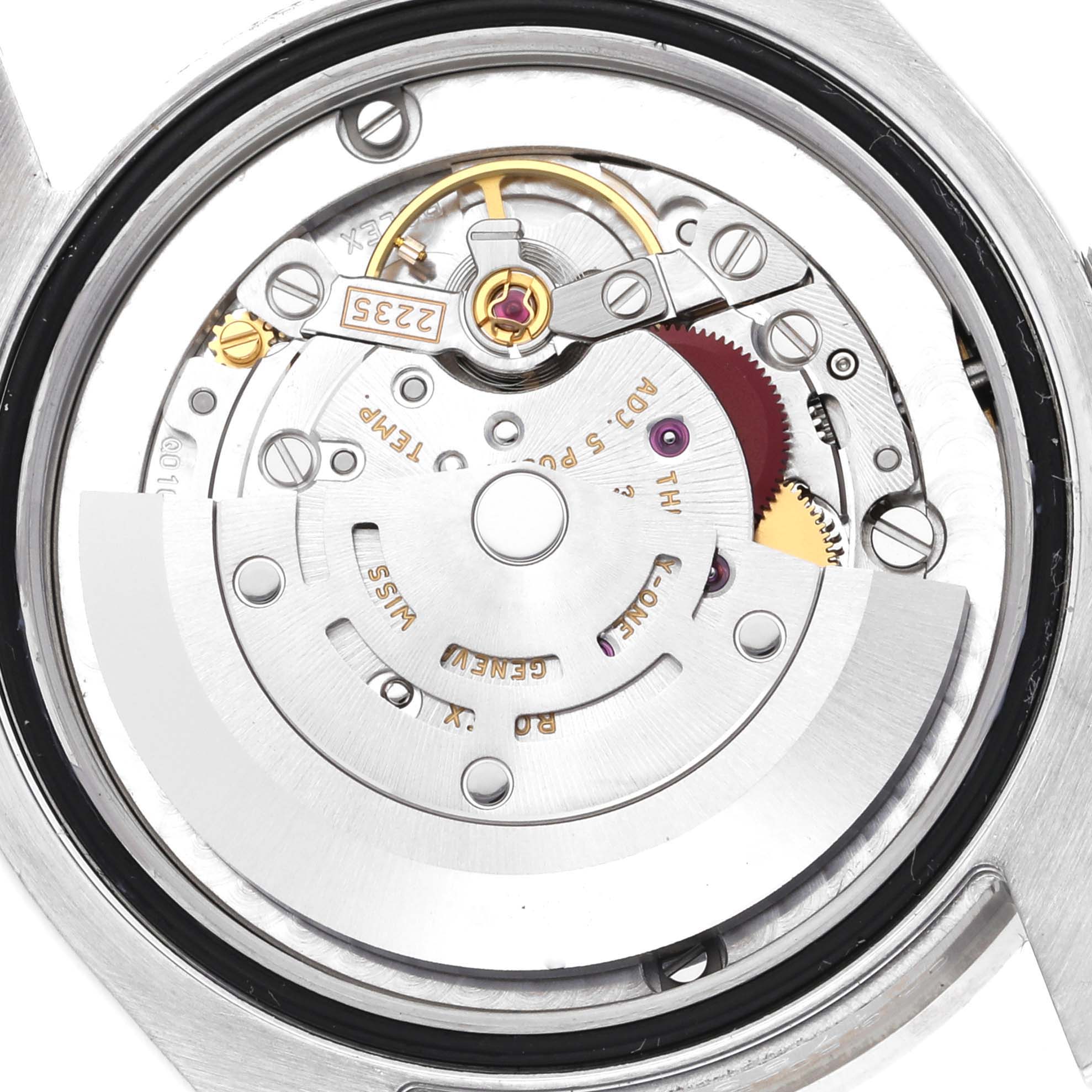 This image shows the internal mechanism of a Mid-Size Rolex watch from a rear angle, focusing on the movement components.