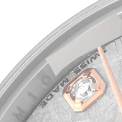 This image shows a close-up of a Rolex Datejust 179171 Women's Steel and Gold (two tone) Silver Dial 179171 Women's Steel and Gold (two tone) Silver Dial watch, focusing on the dial with a diamond marker and part of the minute hand.