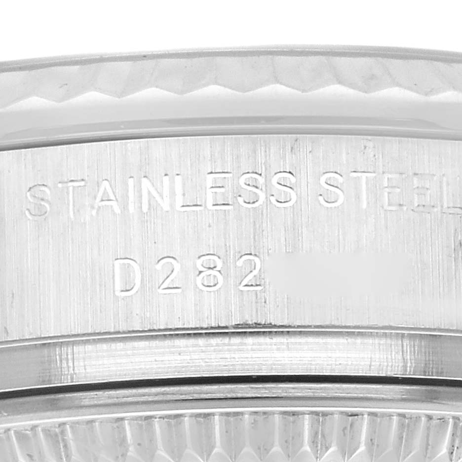 This image shows the engraved side of the bezel of a Rolex Datejust 179174 Women's Stainless Steel Black Dial 179174 Women's Stainless Steel Black Dial watch, highlighting the stainless steel identification.