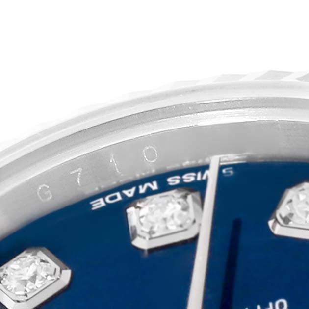 The image shows a partial view of the blue dial and diamond markers on a Rolex Datejust 179174 Women's Stainless Steel Blue Dial 179174 Women's Stainless Steel Blue Dial watch.