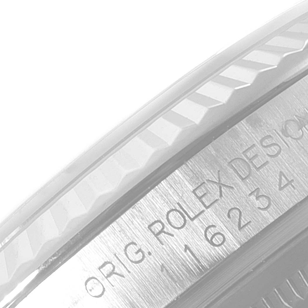 This is a close-up of the bezel and serial number engraving on the side of the Rolex Datejust 116234 Men
s Stainless Steel Black Dial 116234 Men
s Stainless Steel Black Dial watch.