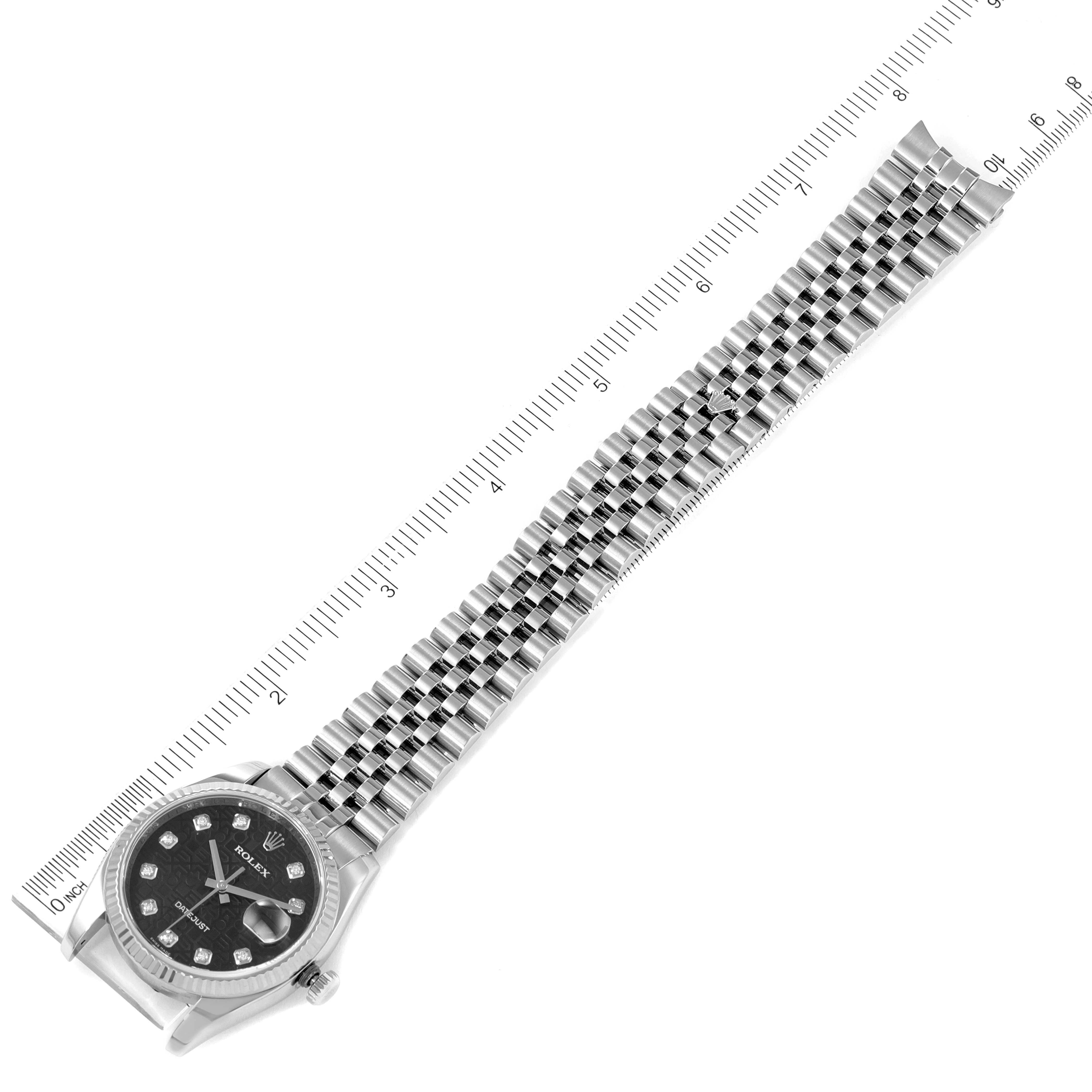 The image shows a top-down view of a Rolex Datejust 116234 Men
s Stainless Steel Black Dial 116234 Men
s Stainless Steel Black Dial watch, including the face, case, and full metal bracelet, alongside a measuring scale.