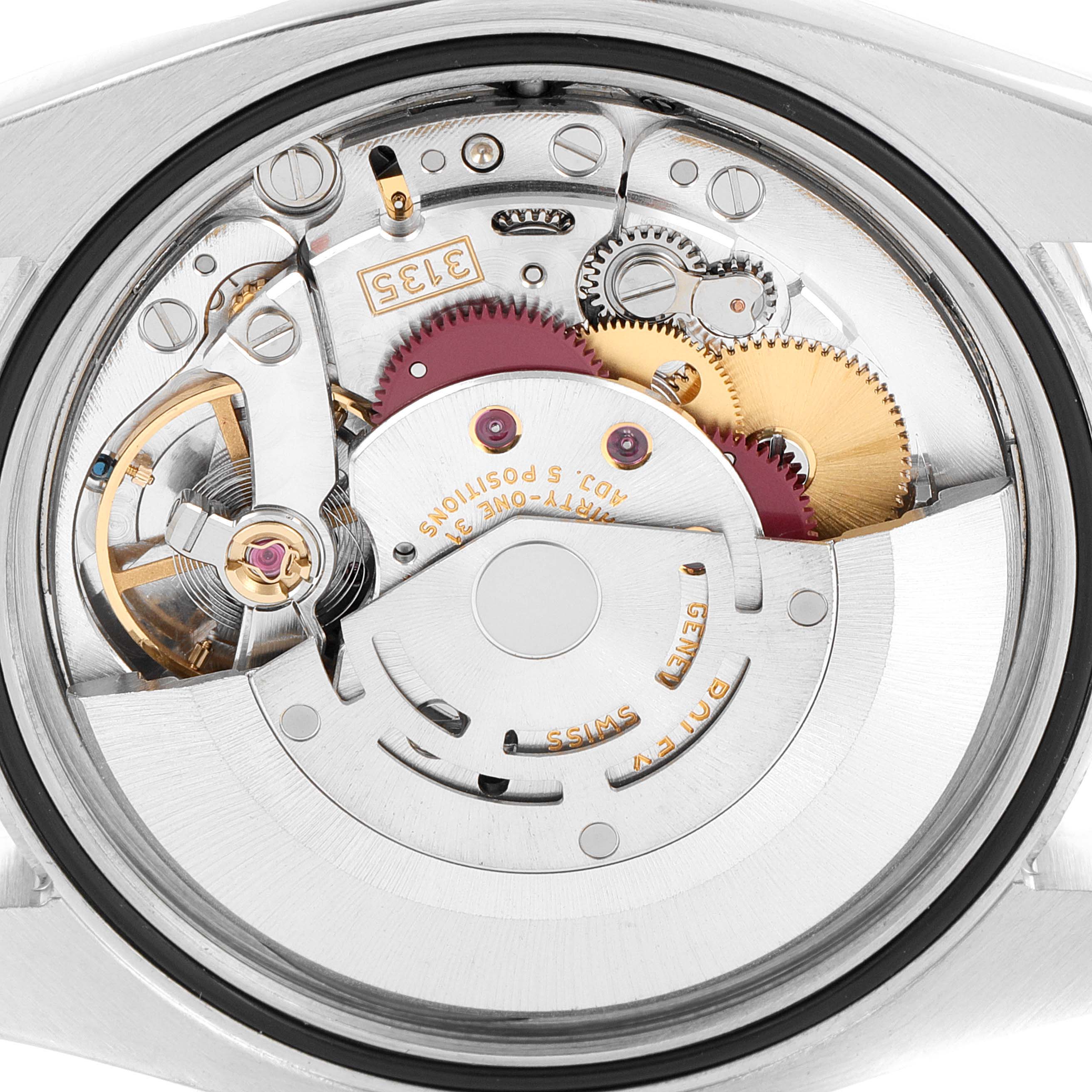 This image shows the interior mechanical movement of a Rolex Datejust 116234 Men
s Stainless Steel Black Dial 116234 Men
s Stainless Steel Black Dial watch from a rear angle, highlighting gears and components.