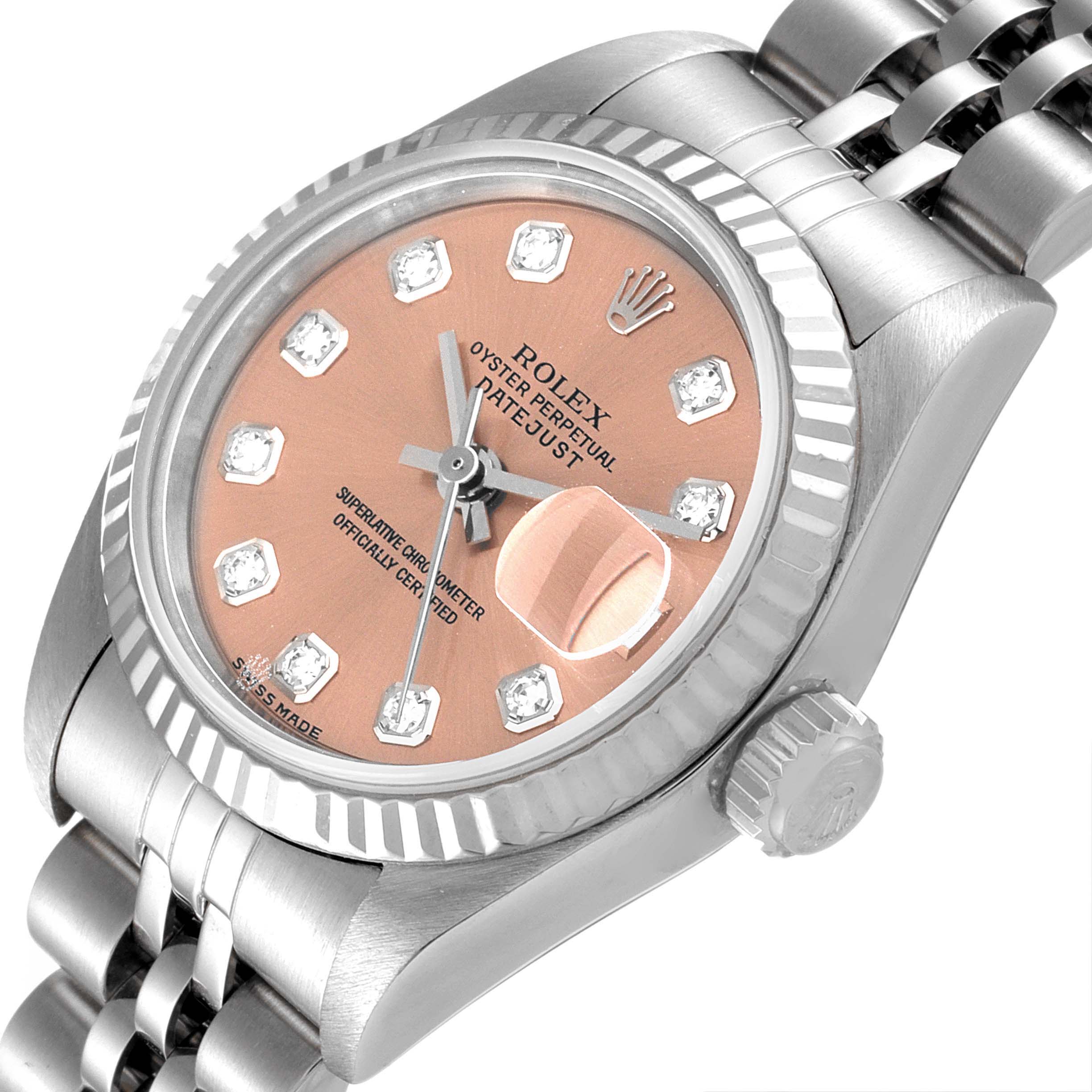 The Rolex Datejust 79174 Women's Stainless Steel Pink Dial 79174 Women's Stainless Steel Pink Dial watch is shown at an angled top-down view, highlighting its pink dial, bezel, crown, and part of the bracelet.