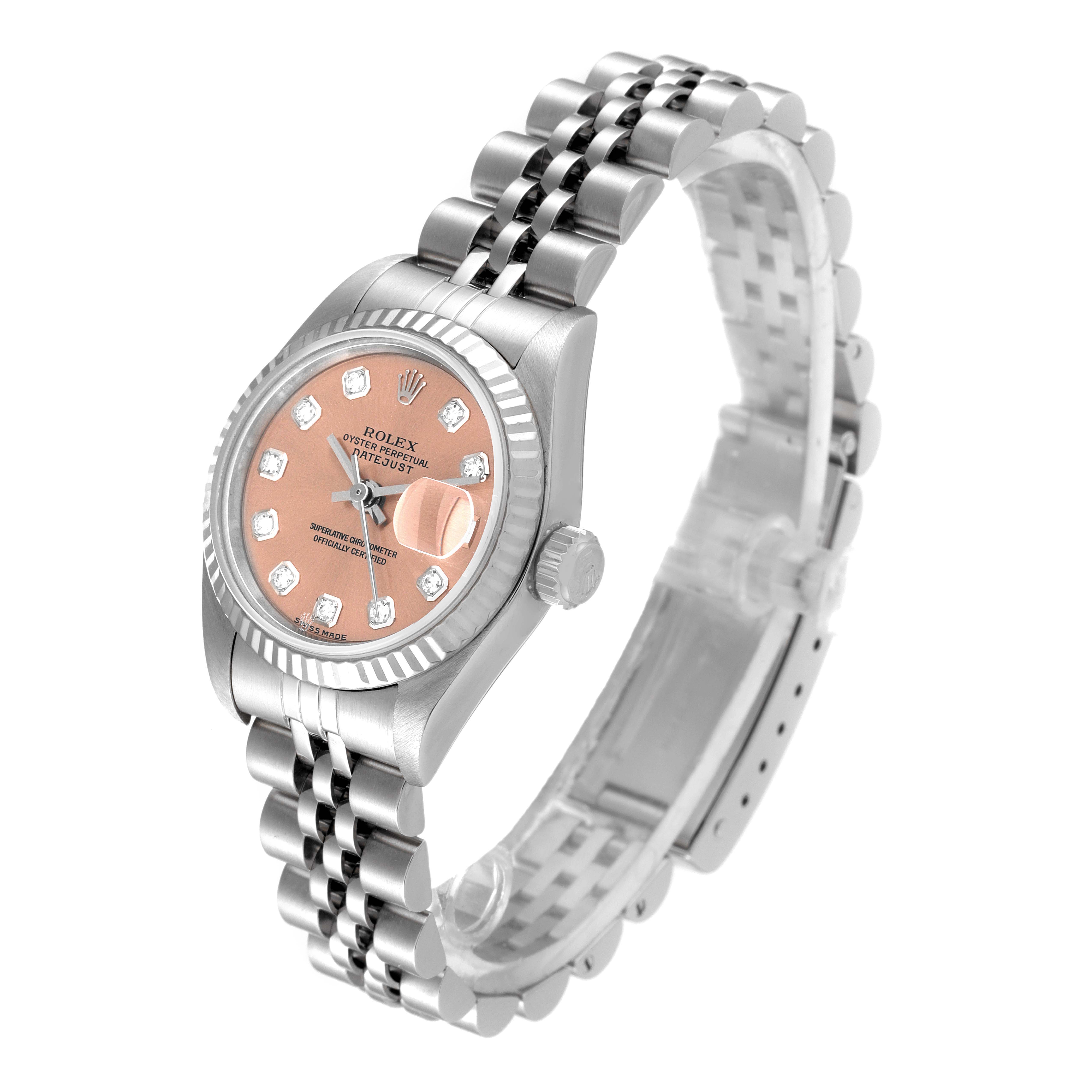 This image shows a Rolex Datejust 79174 Women's Stainless Steel Pink Dial 79174 Women's Stainless Steel Pink Dial watch at an angled view, highlighting its pink dial, diamond markers, and stainless steel bracelet.