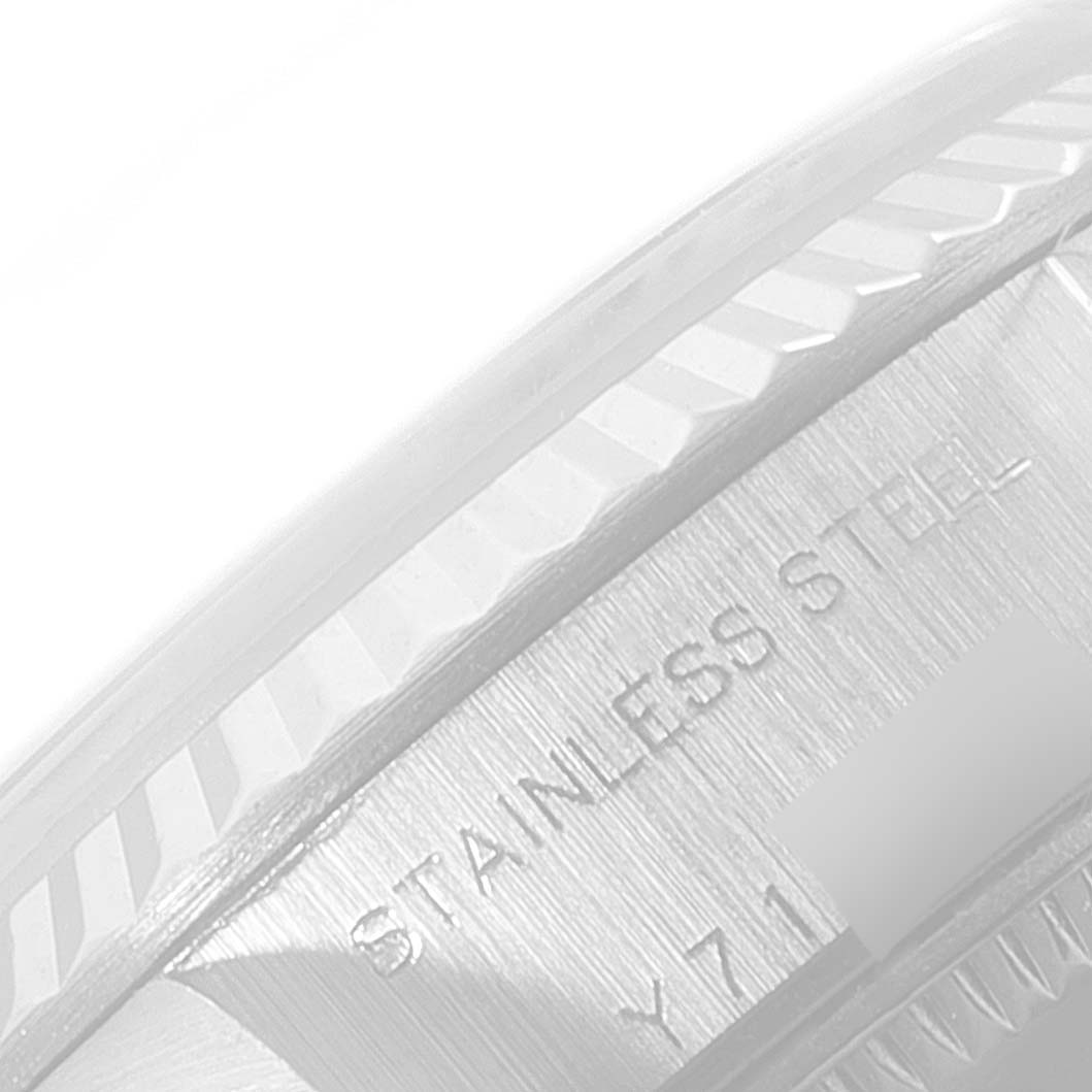 The image shows a close-up angle of the case side and fluted bezel of a Rolex Datejust 79174 Women's Stainless Steel Pink Dial 79174 Women's Stainless Steel Pink Dial watch, with "STAINLESS STEEL" inscribed.