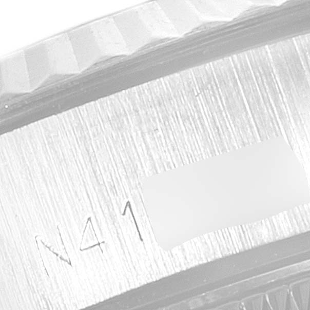 The image shows a close-up of the bezel and serial number engraving on a Rolex Datejust 69174 Women's Stainless Steel Silver Dial 69174 Women's Stainless Steel Silver Dial watch.