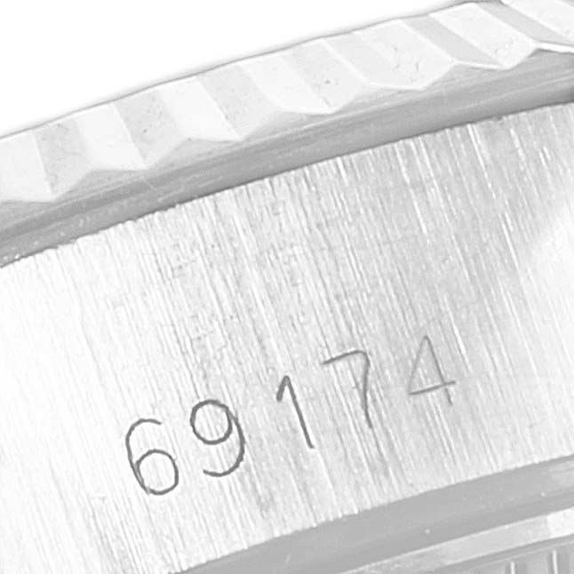 This image shows a close-up of the case and serial number of the Rolex Datejust 69174 Women's Stainless Steel Silver Dial 69174 Women's Stainless Steel Silver Dial model 69174.
