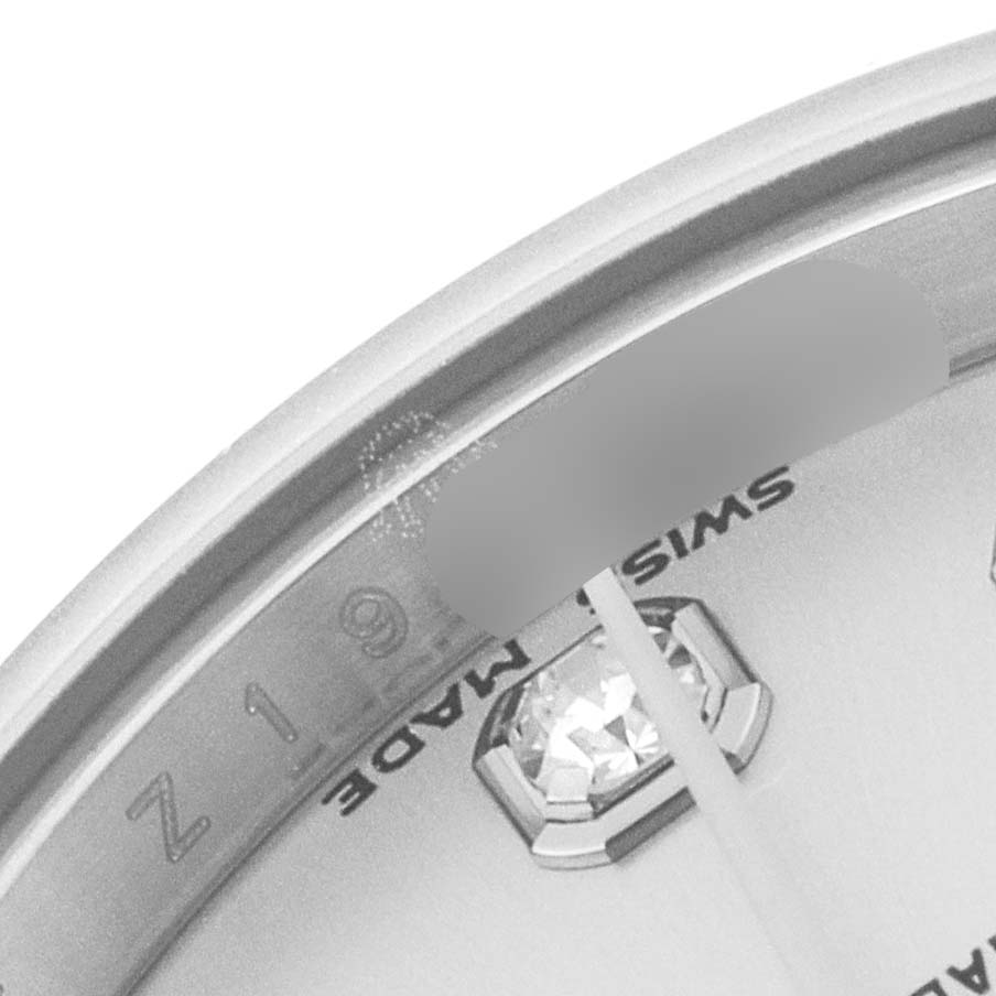 This image shows a close-up of the dial, bezel, and part of the gem-set marker of a Rolex Datejust 179174 Women
s Stainless Steel Silver Dial 179174 Women
s Stainless Steel Silver Dial watch.