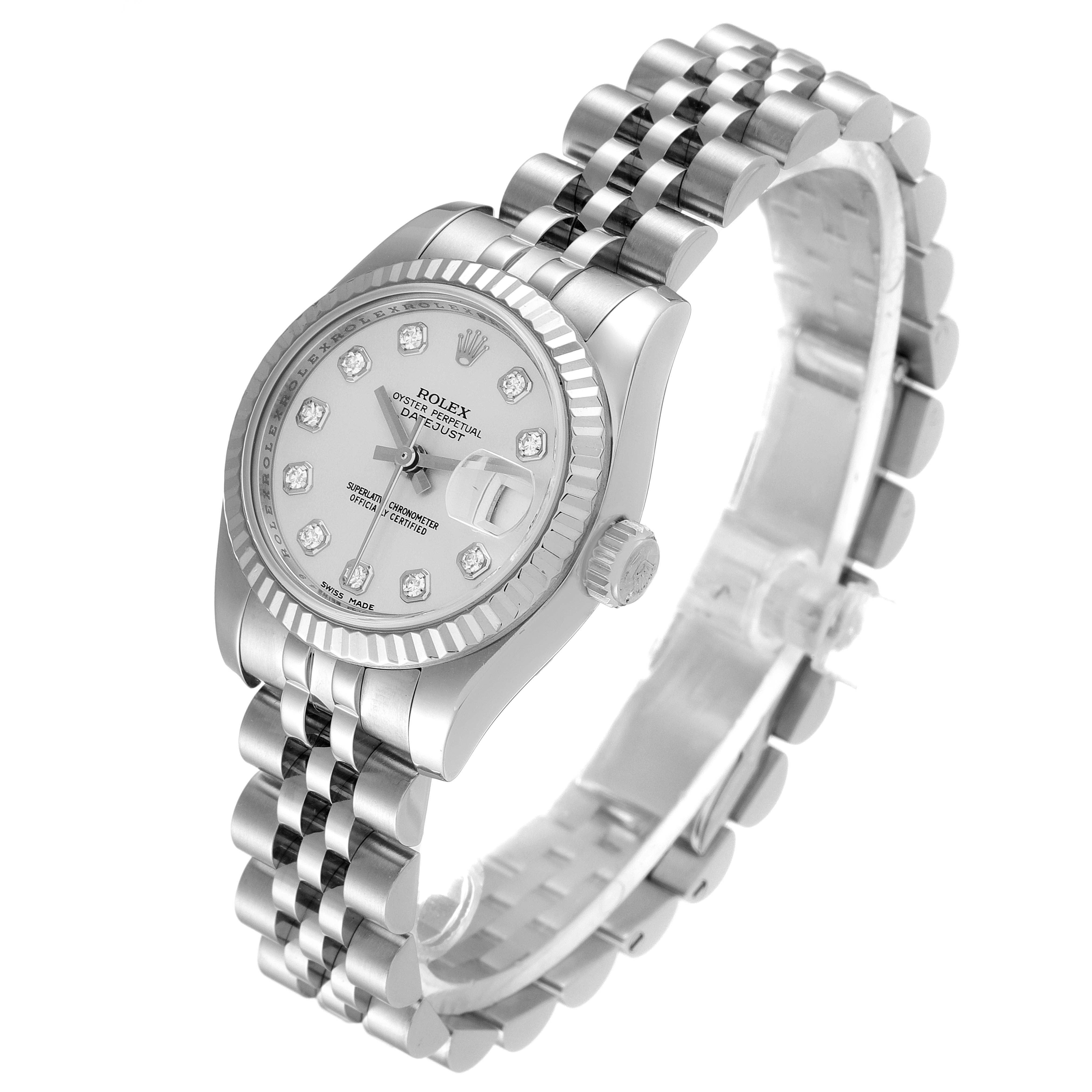 This Rolex Datejust 179174 Women
s Stainless Steel Silver Dial 179174 Women
s Stainless Steel Silver Dial watch is shown at an angled view highlighting the face, fluted bezel, crown, and linked bracelet.