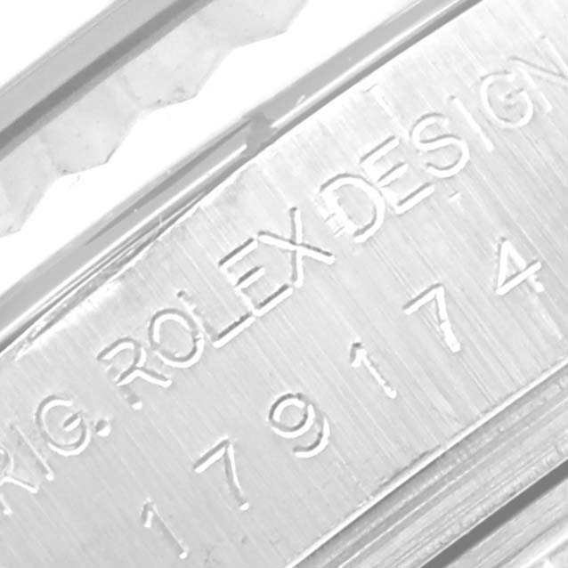 The close-up image shows the engraved serial number on the side of a Rolex Datejust 179174 Women's Stainless Steel Silver Dial 179174 Women's Stainless Steel Silver Dial model.