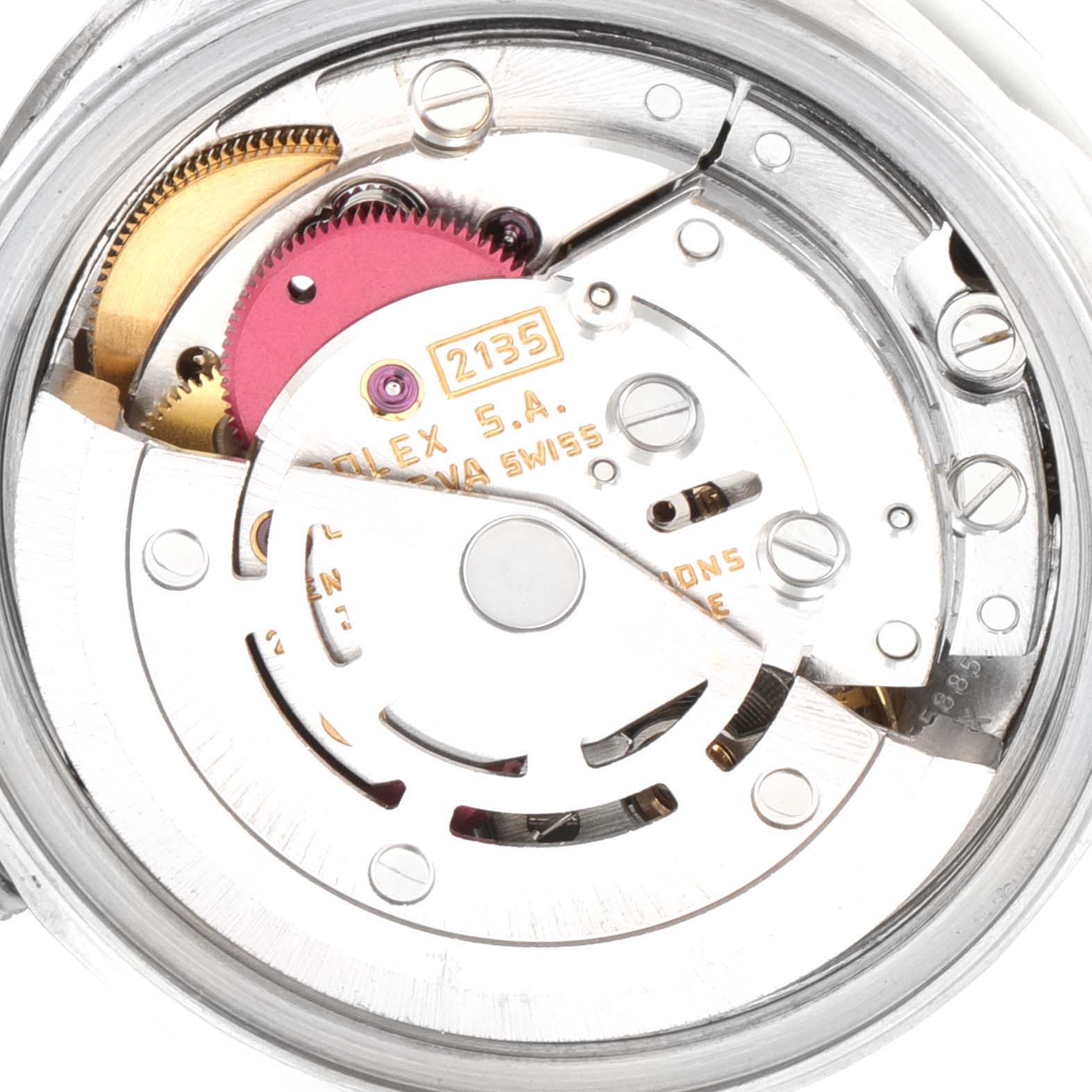 The image shows a close-up of the movement inside a Rolex Datejust 69174 Women
s Stainless Steel Silver Dial 69174 Women
s Stainless Steel Silver Dial watch, displaying gears and internal components.